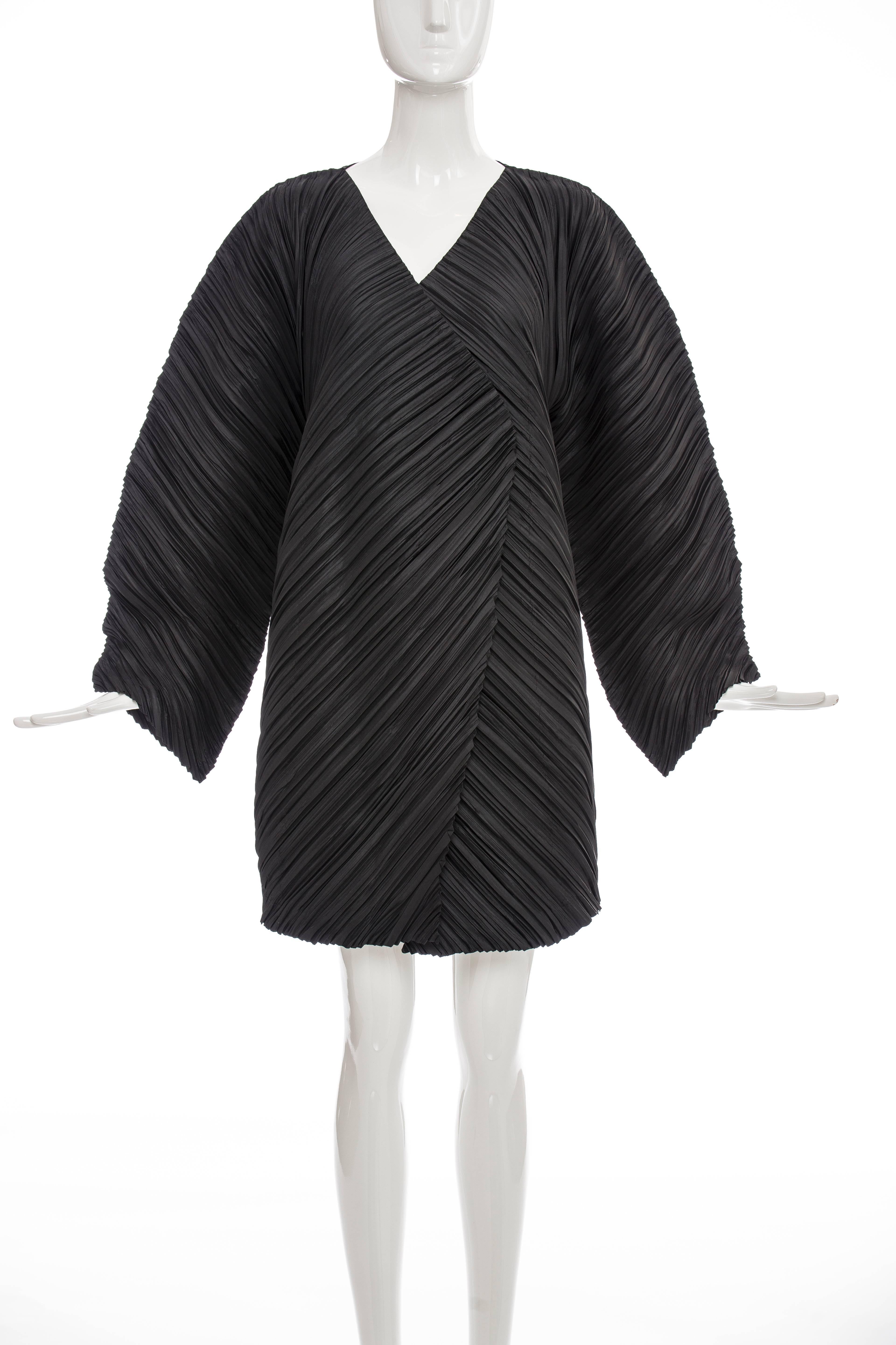 Issey Miyake, Spring 1995 black pleated polyester cocoon jacket with black on white woven label.