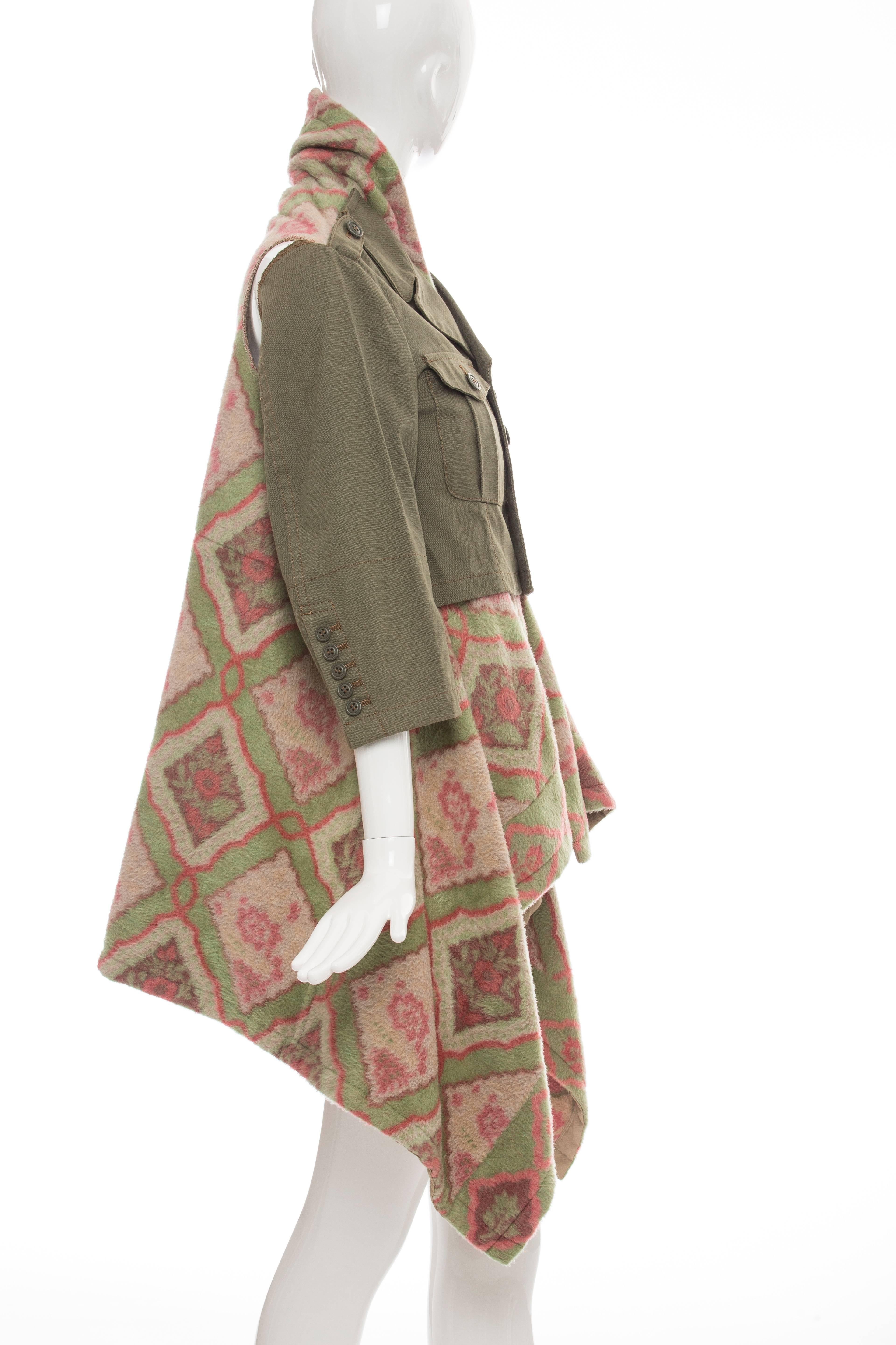 Comme des Garçons, Fall 2009 coat with dual patch pockets at front, dual welt pockets at interior lining, notched lapels, layered fleece inset featuring abstract print throughout, shoulder cutouts at rear, asymmetrical hem and button-up closures at