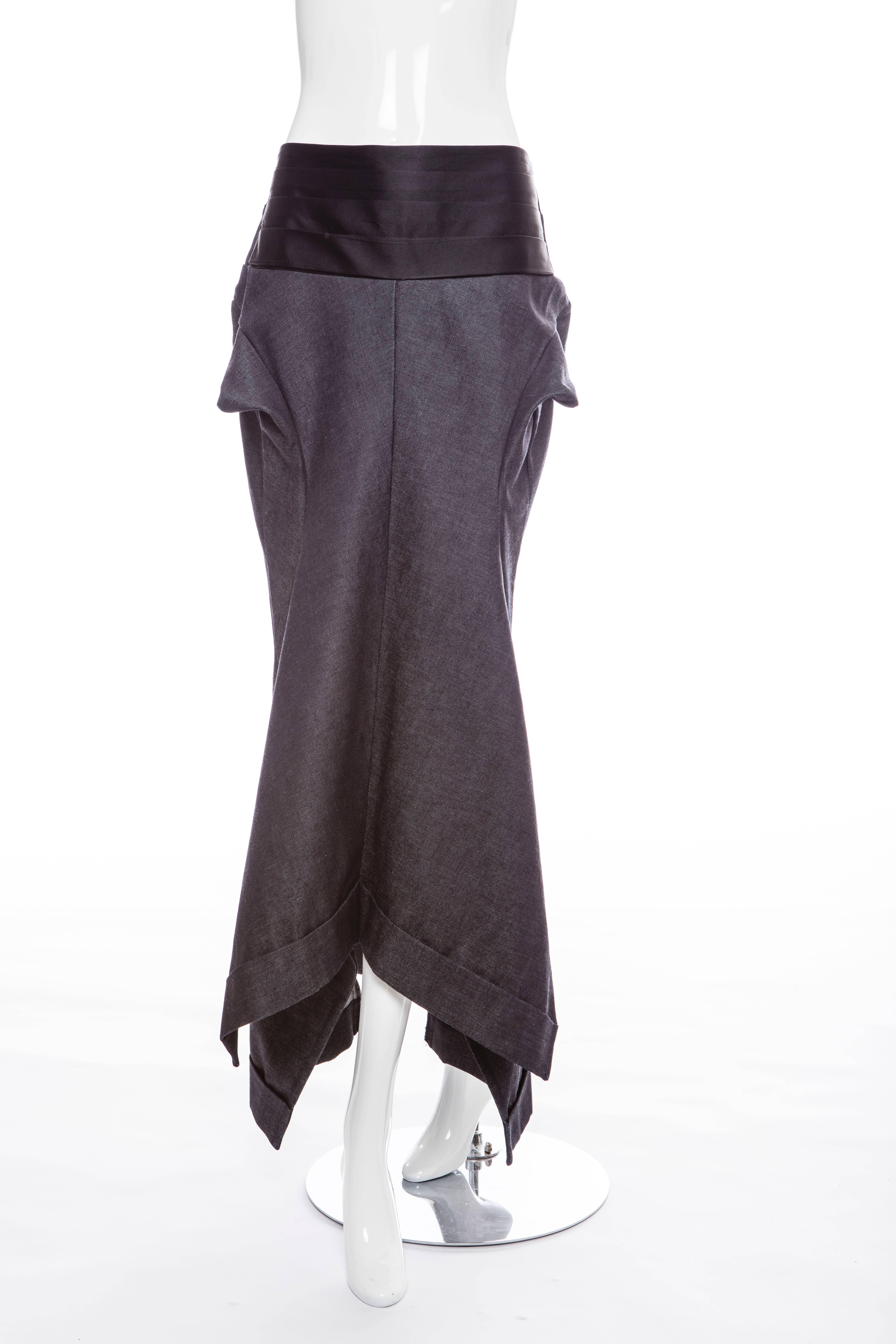 Junya Watanabe for Comme des Garcons, dark denim skirt with black satin cummerbund, invisible back zipper with hook/eye, two back button pockets and cuff hem.