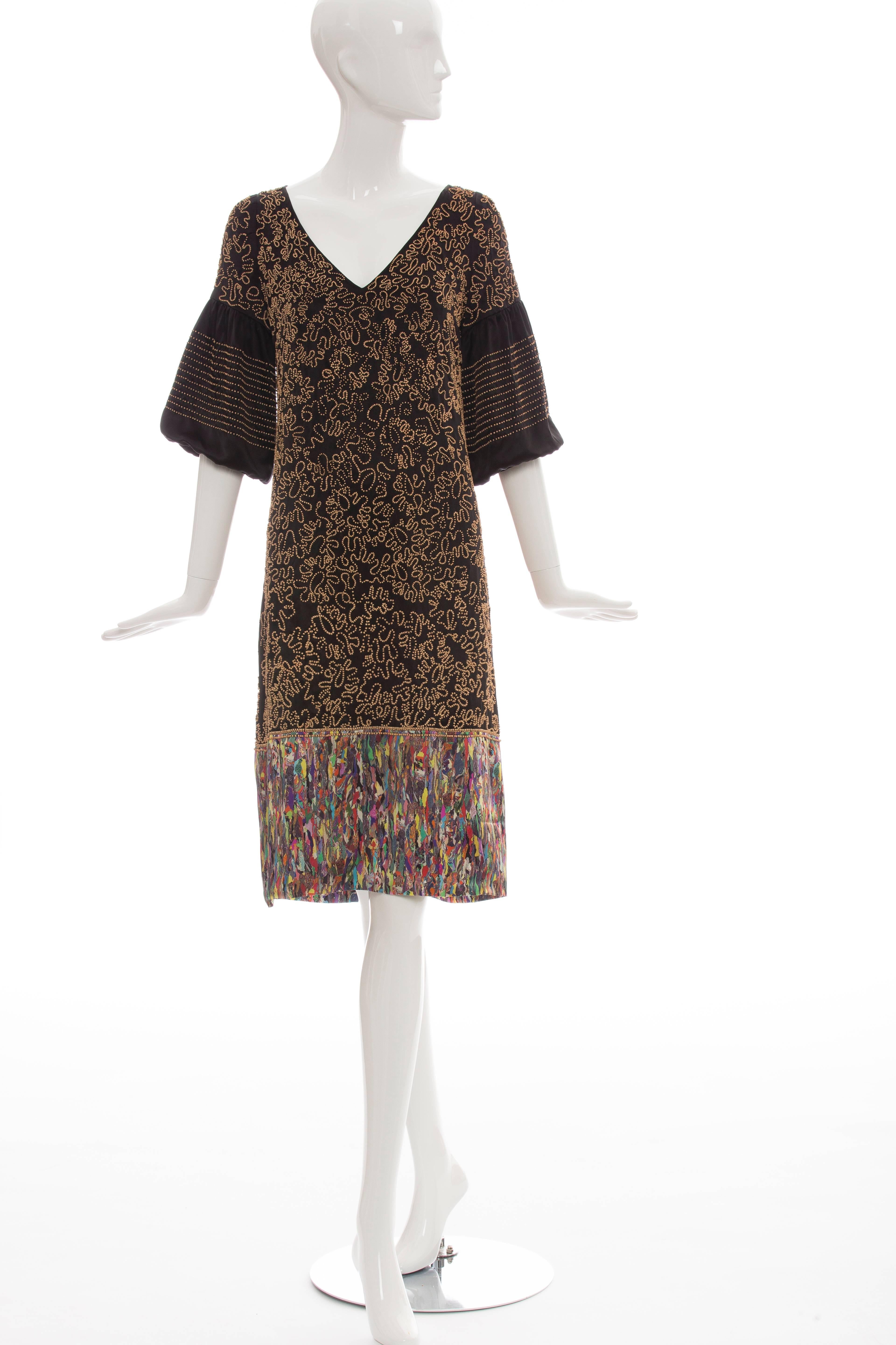 Dries Van Noten, Autumn-Winter 2008 silk dress with V-neck, wood beaded embellishments throughout and contrast trim at hem.

FR. 38
US. 6

Bust 38”, Waist 36”, Hip 42”, Length 40”
Fabric Content: 100% Silk