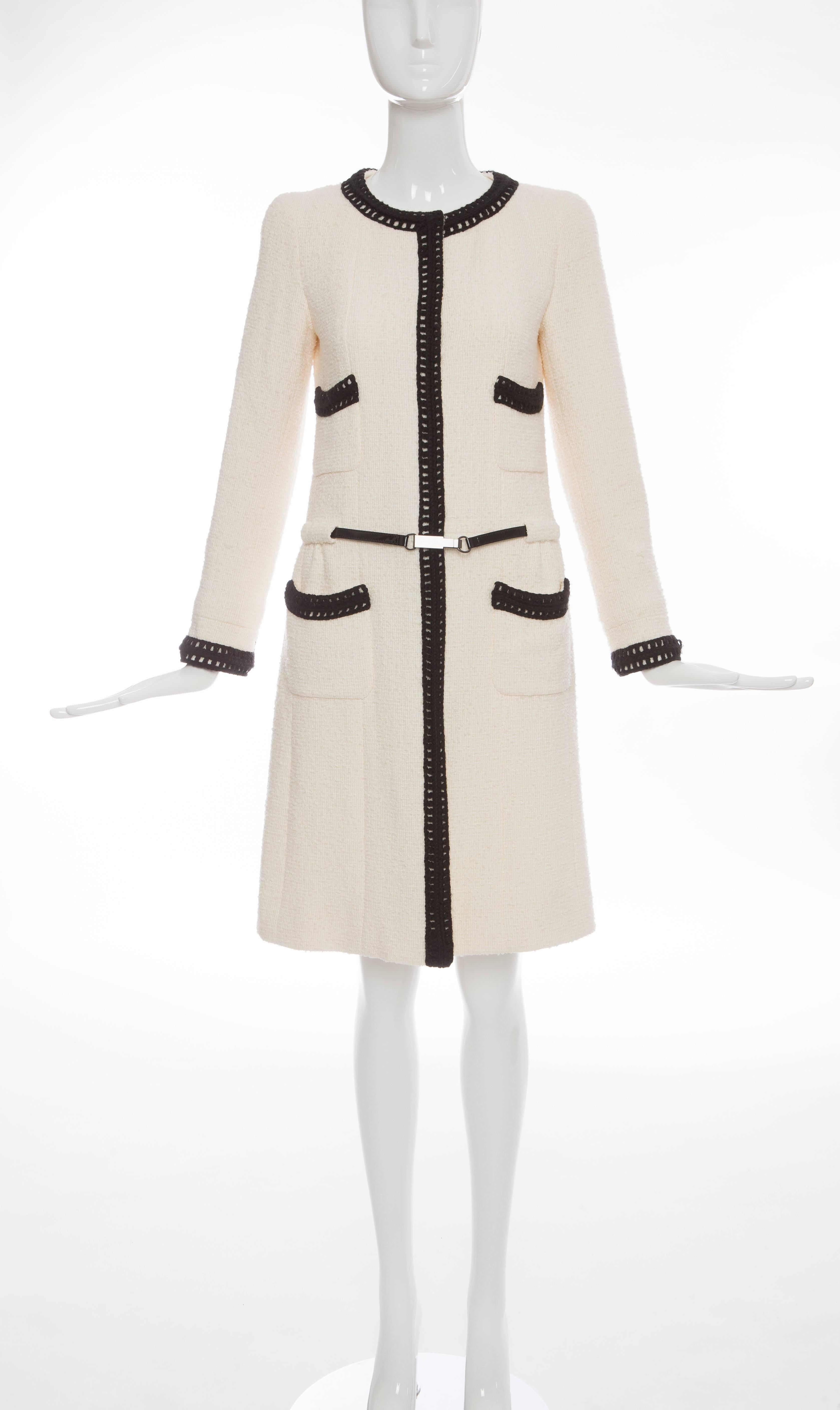 Chanel, Autumn - Winter 2000, white wool coat of alpaca and wool tweed, snap front, four front pockets, black knit trim, black patent belt and fully lined in silk.

This Karl Lagerfeld / Chanel coat is part of the Kyoto Costume Institutes fashion