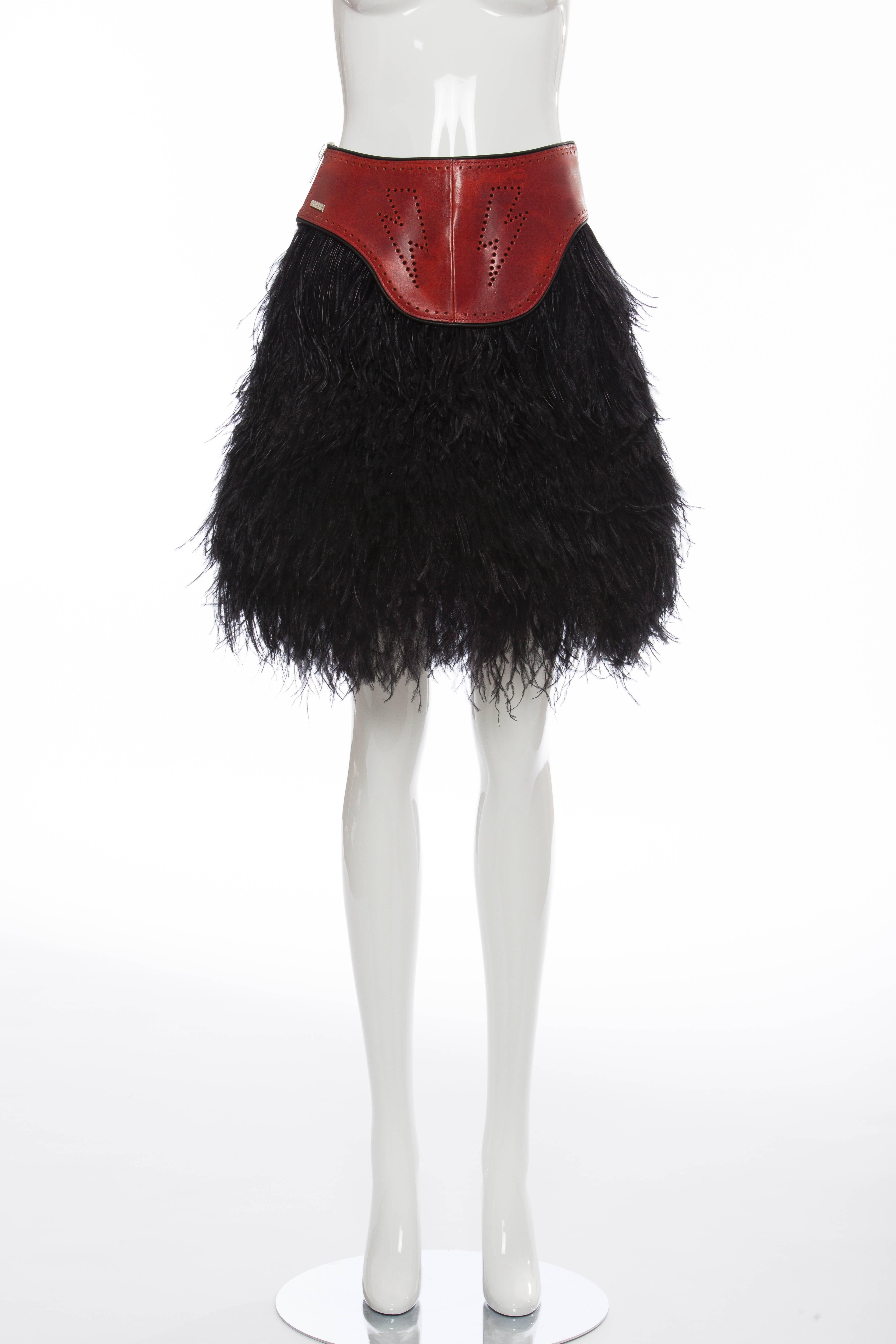 Dsquared², Fall 2008 ostrich feather skirt with red leather panel at waist featuring perforated trim and exposed silver-tone zip closure at side seam.

IT. 40
US. 4

Waist 26”, Hip 36”, Length 19