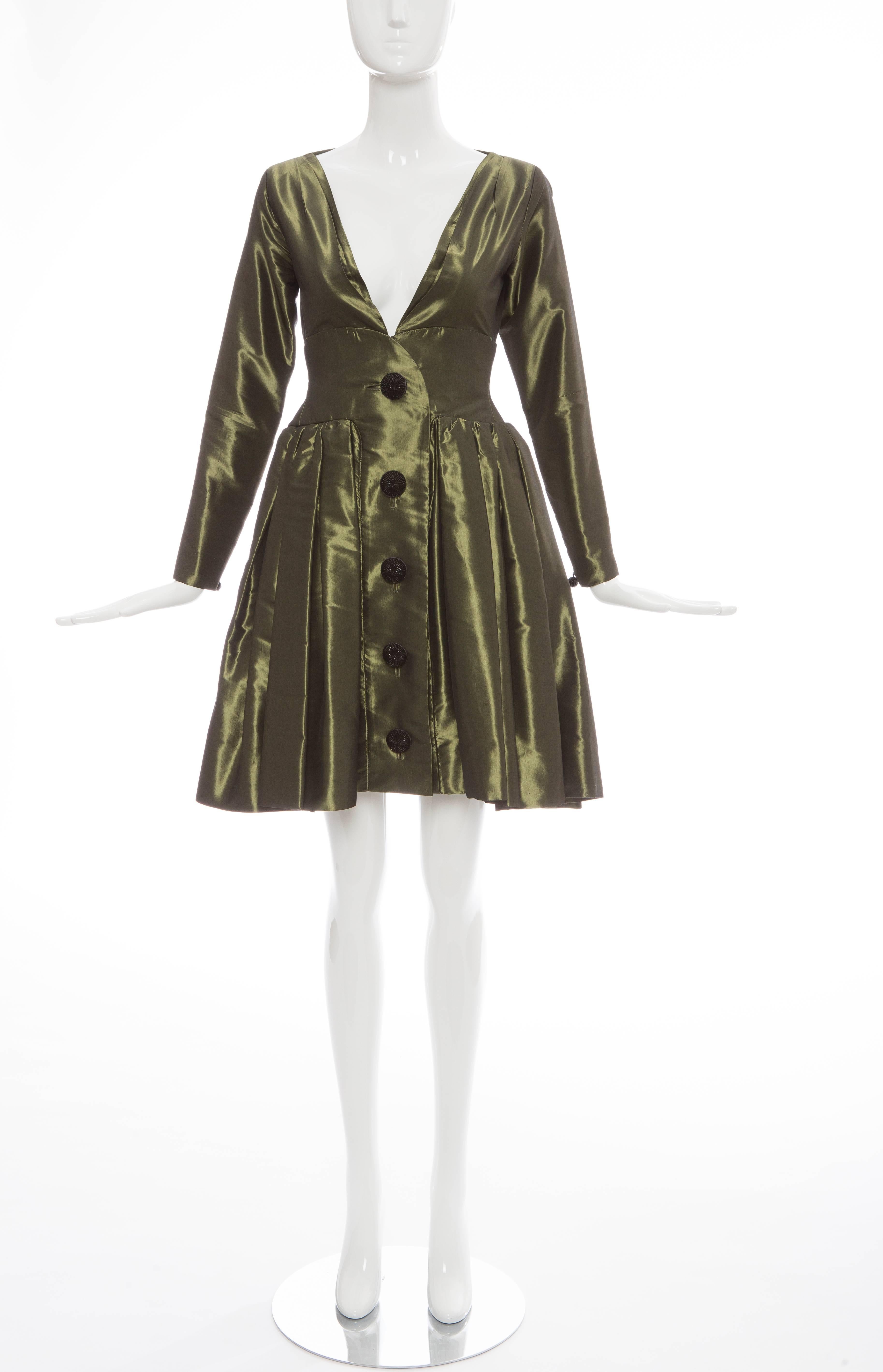 Yves Saint Laurent Rive Gauche, circa 1980's olive green silk taffeta bouffant evening dress, button front, deep V neckline, fitted waist, skirt with box pleats, long fitted zip sleeve and skirt portion is fully lined.

EU.36