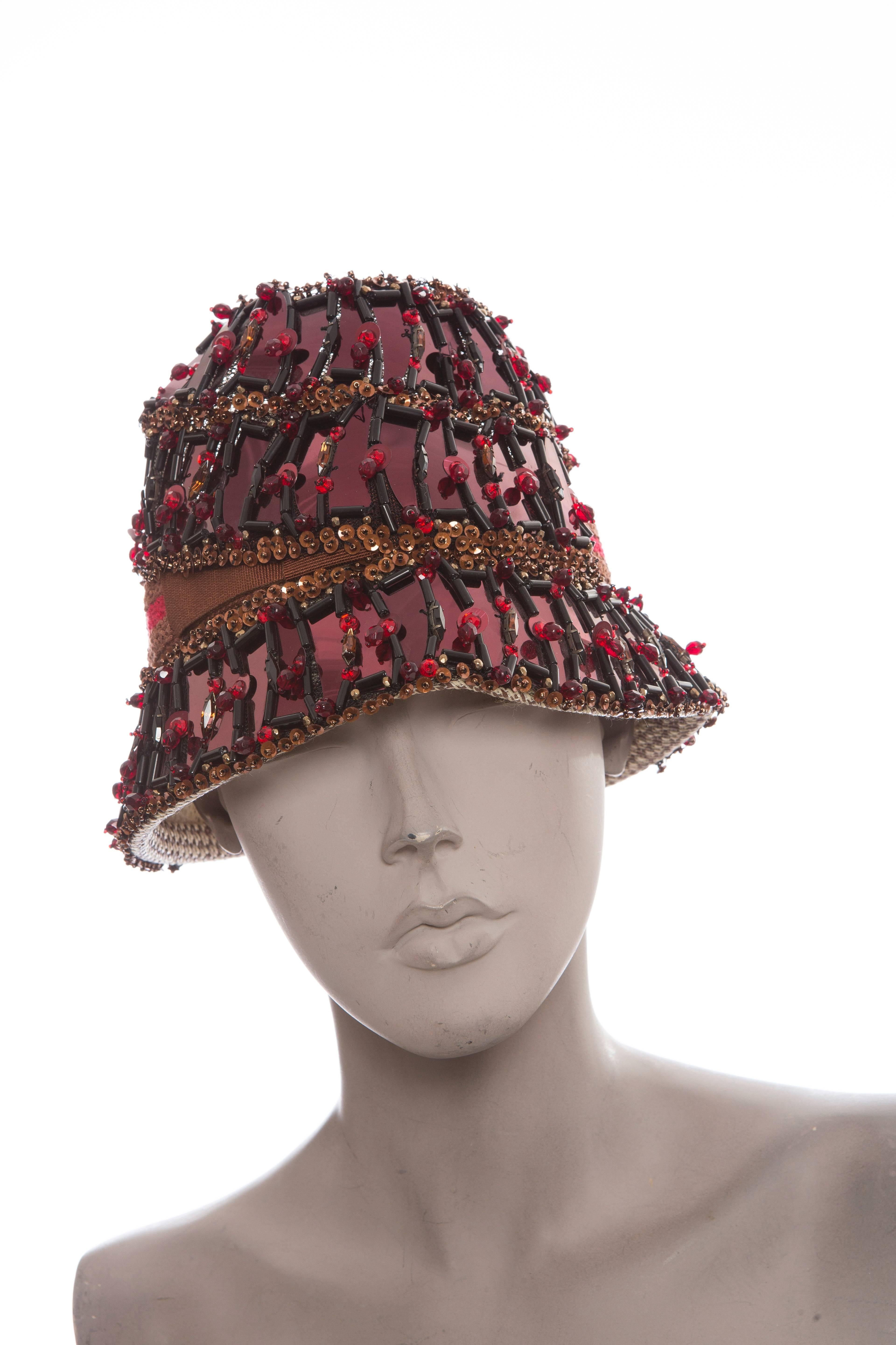 Prada, Spring/Summer 2005 cloche hat with sequin details, bead embellishments, crocheted trim, woven top and brim.

Circumference 22”, Brim 2.25”