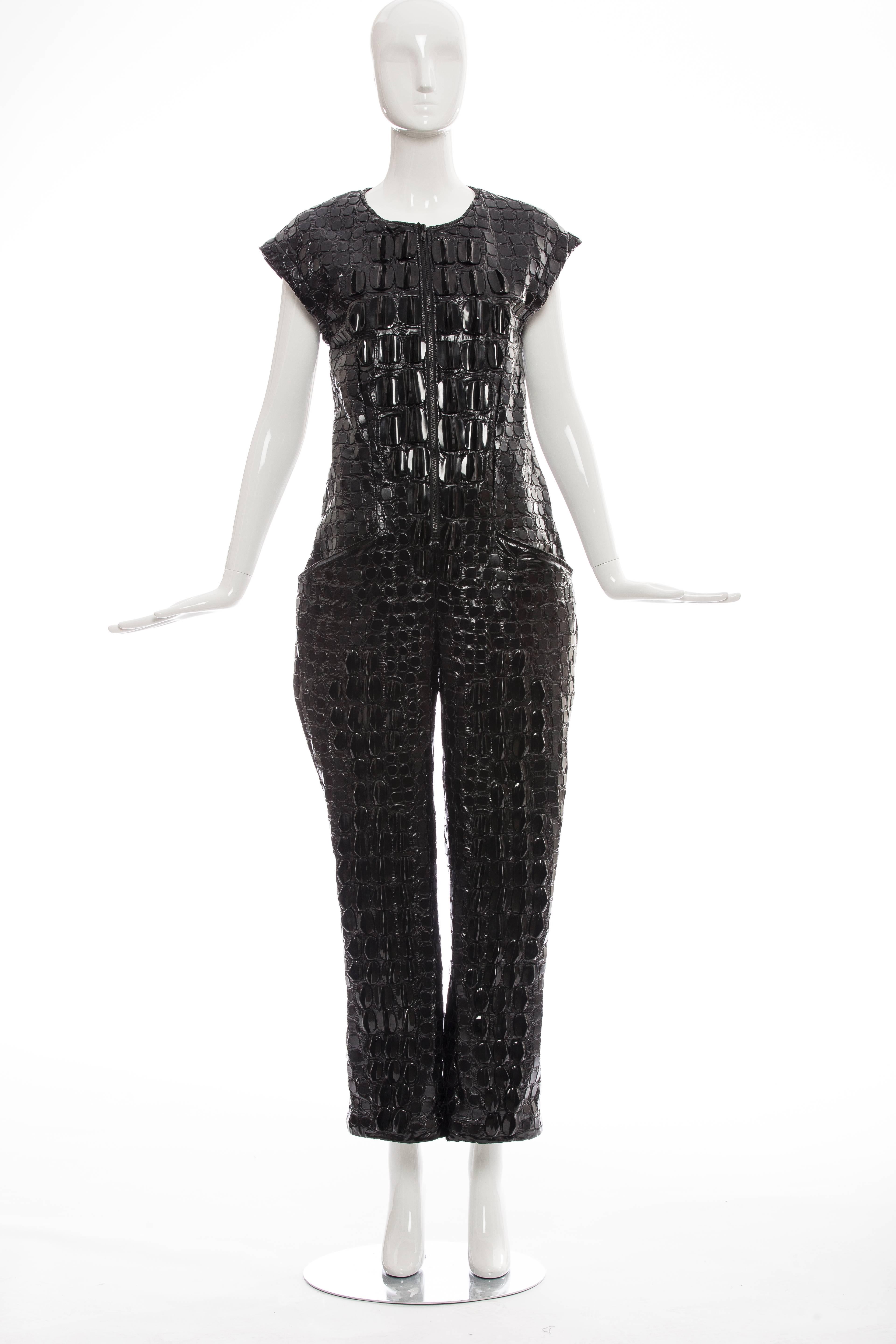 KTZ, Spring 2015 sleeveless nylon jumpsuit with embroidered 3D crocodile skin throughout featuring black hardware scale embellishments, dual seam pockets at sides and exposed zip closure at center front.

Bust 36”, Waist 34”, Hip 34”, Rise 8”,