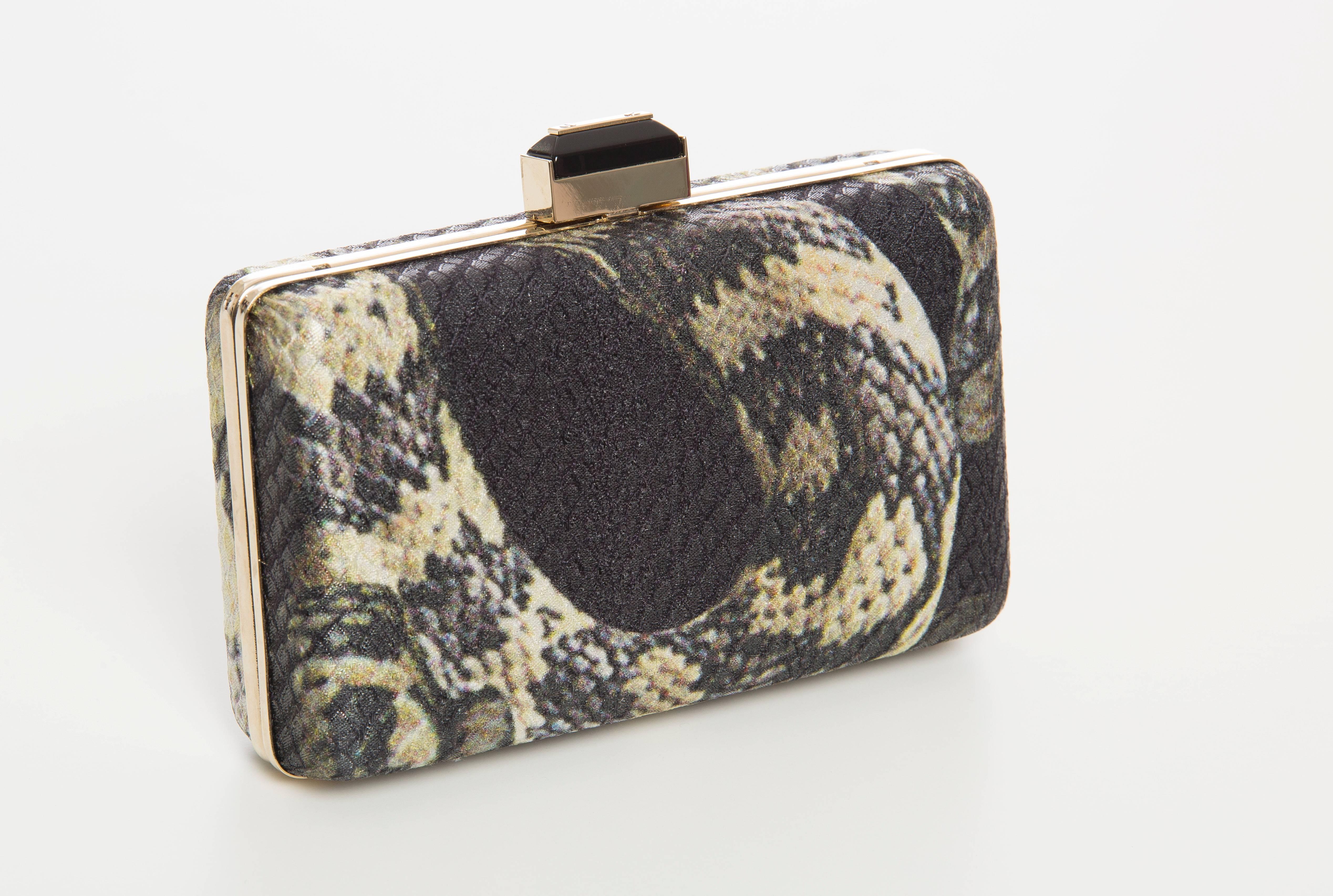 Lanvin by Alber Elbaz, Spring-Summer 2012, python print minaudière clutch with gold-tone hardware, single drop-in shoulder strap, black satin lining and jeweled push-lock closure at top. Includes dust bag and tags.

Height 4”, Width 6”, Depth 2”