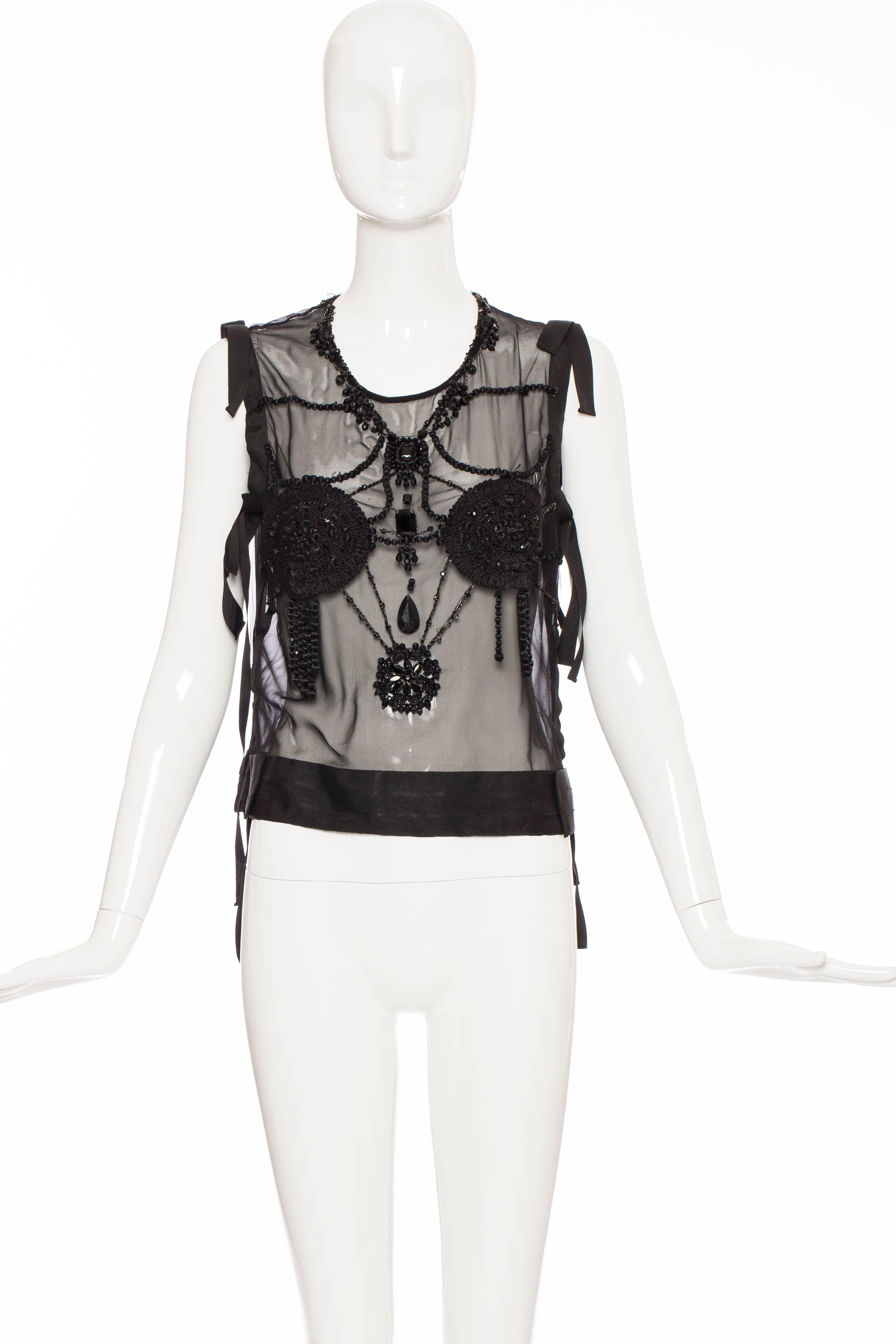  Tom Ford for Yves Saint Laurent, Autumn/Winter 2003, runway sleeveless embroidered beaded silk tulle top with round neck, grosgrain trim and back zip closure.

FR. 42
US. 10

Bust 36”, Waist 34”, Length 20”
Fabric Content: 100% Silk