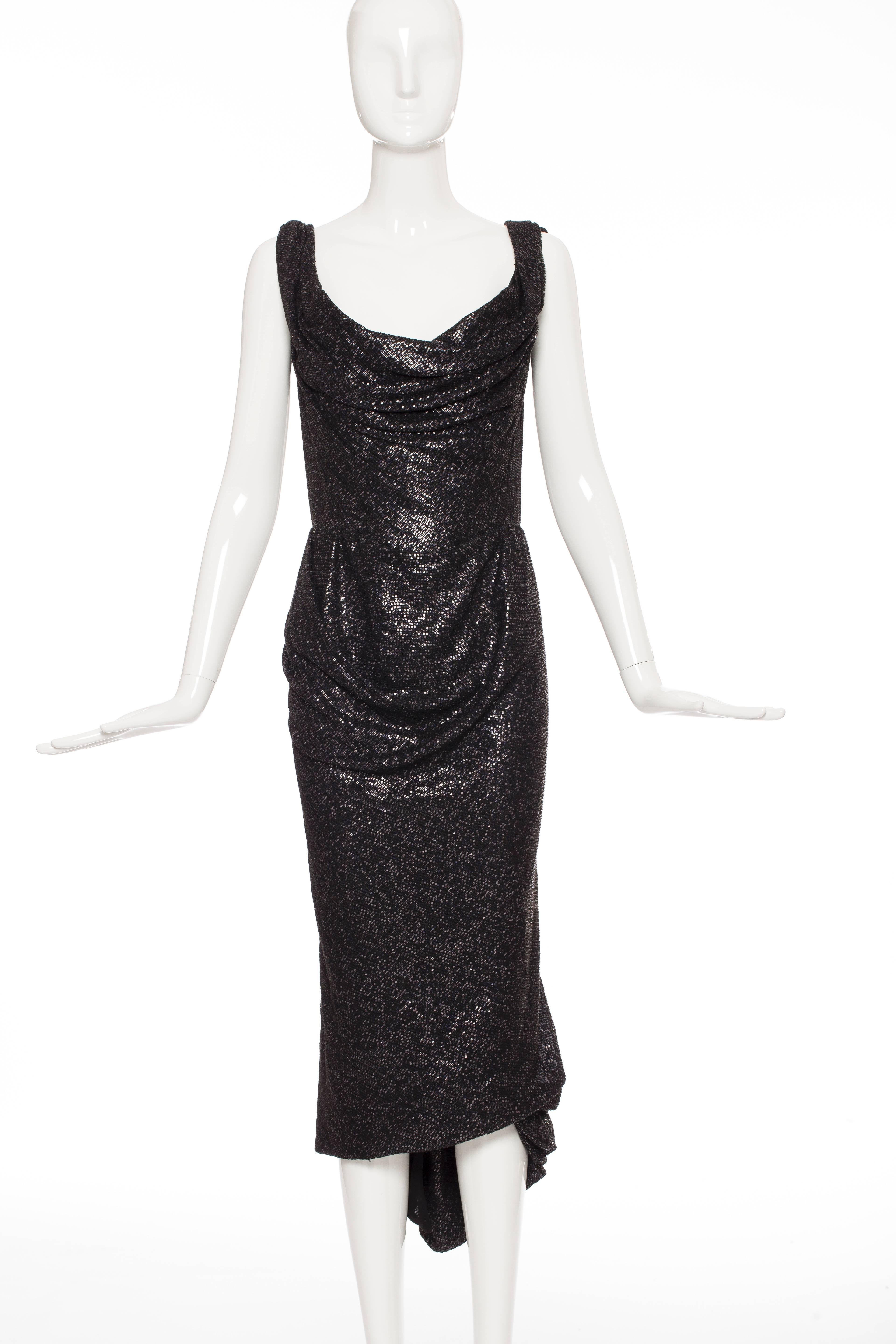 Vivienne Westwood Gold Label, Autumn/Winter 2011, black off-the-shoulder dress with sequined embellishments throughout, corset at lining, draping throughout, fishtail hem at back and back zip closure.

No size label.

Bust 36”, Waist 28”, Hip