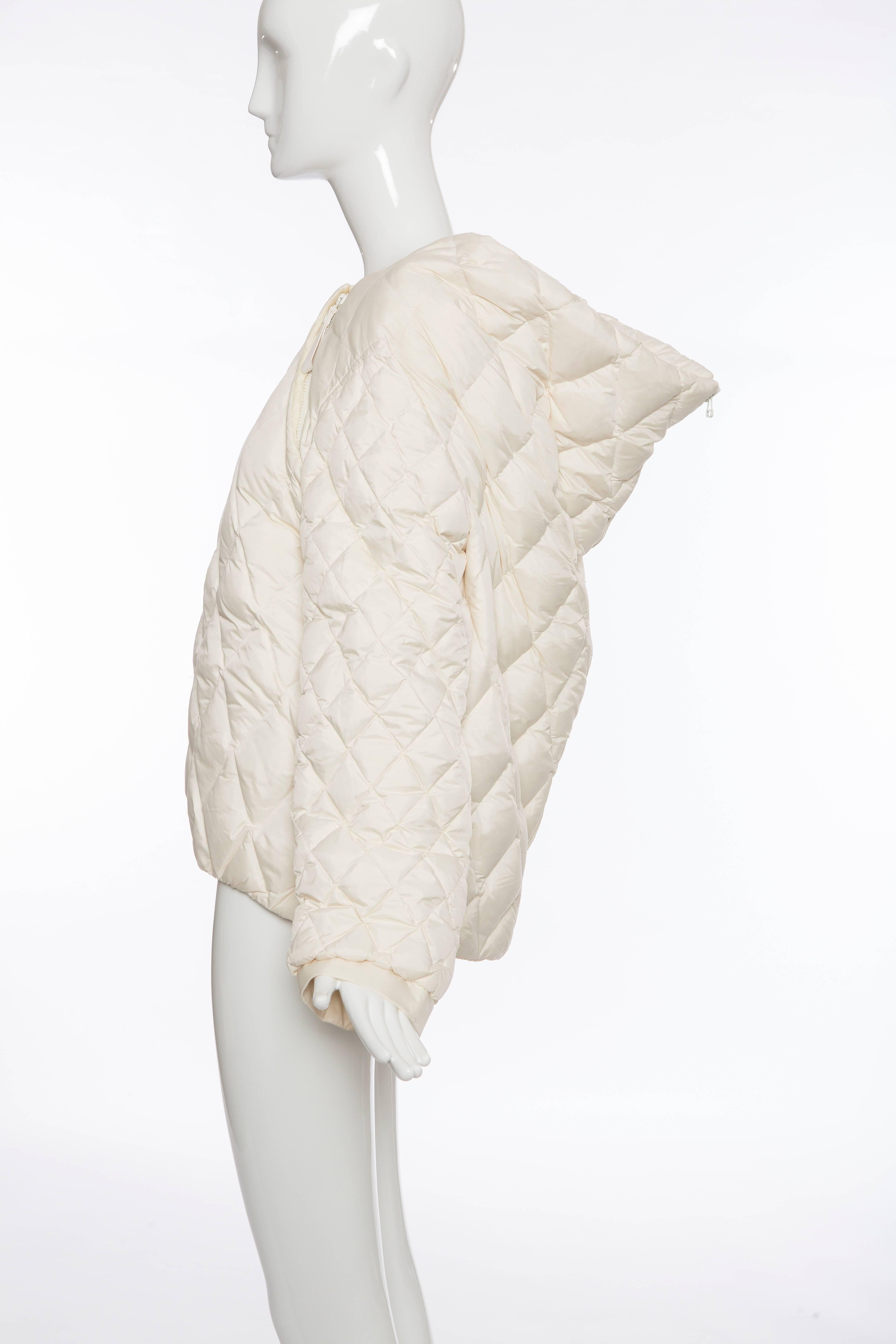 Balenciaga by Nicolas Ghesquière, Autumn/Winter 2010 cream quilted puffer coat with attached underlay, zip closure at back and diagonal zip closure at neckline.

 Size not listed, estimated from measurements.

Bust 40”, Waist 40”, Shoulder 17”,