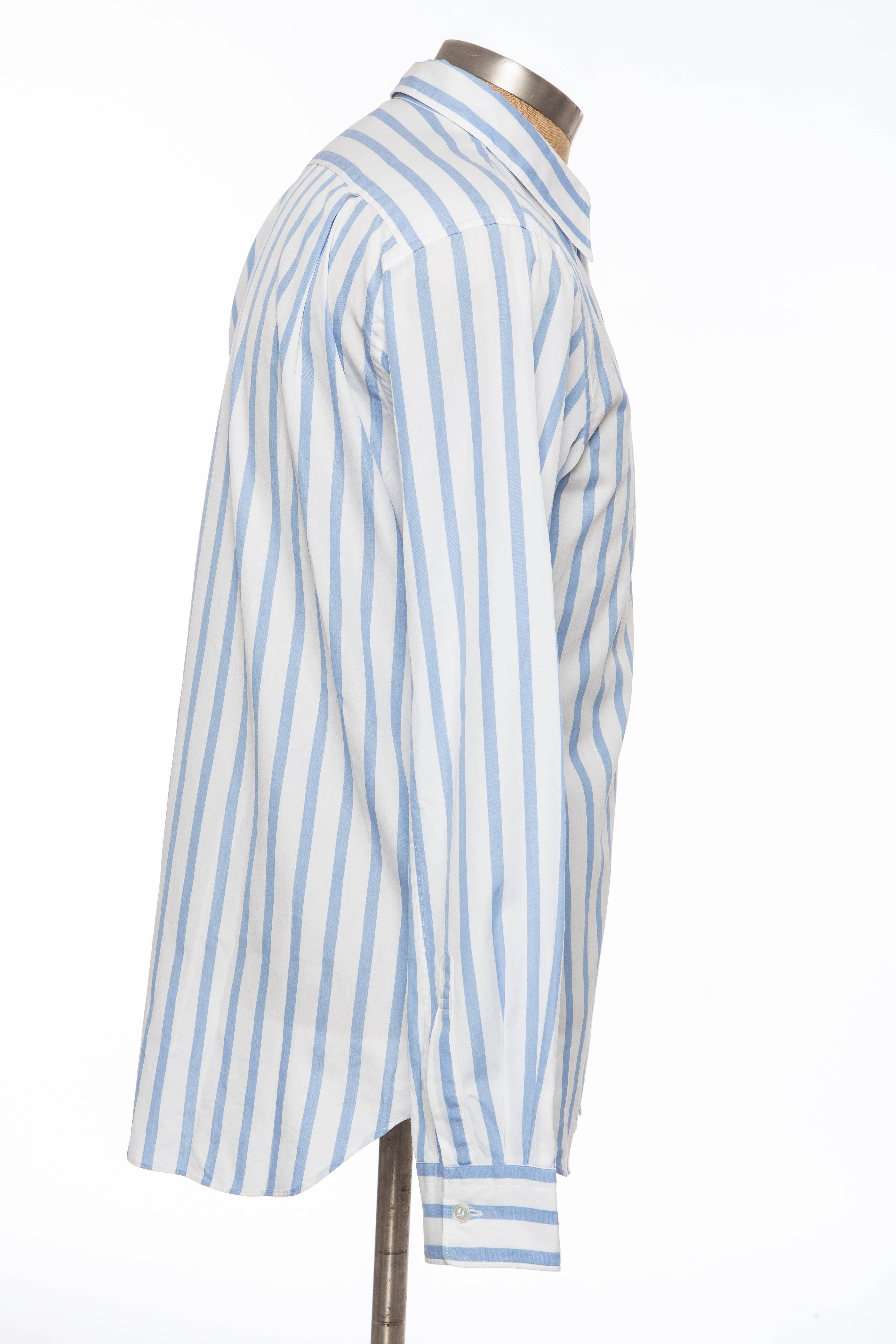 Comme des Garçons Homme Plus, Spring-Summer 2006, striped, cotton shirt with pointed collars, long sleeves, patch pocket at chest, Rolling Stones logo graphic and button closure.

 Neck 15”, Chest 40”, Length 29.5”, Sleeve 32”