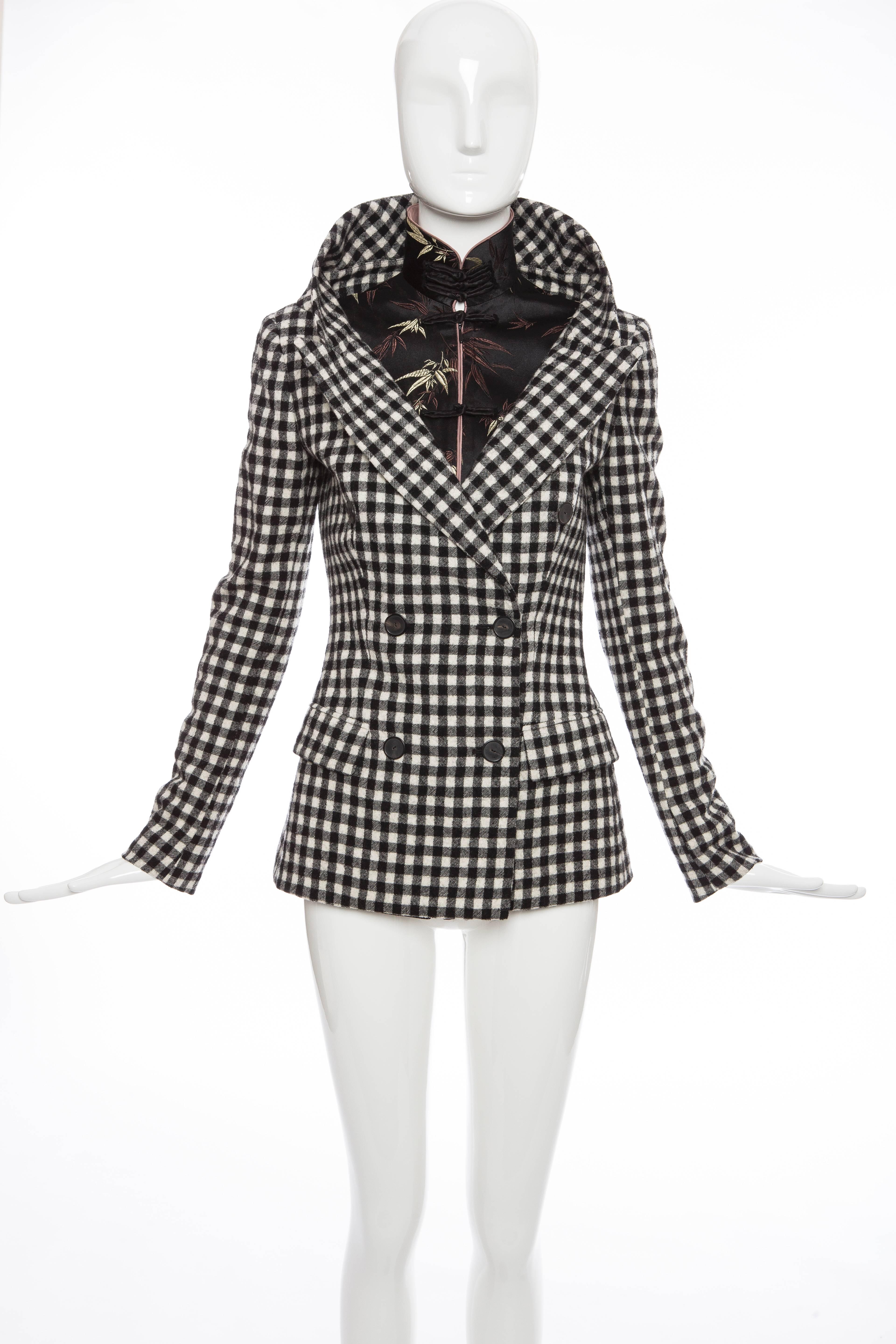Jean Paul Gaultier, Autumn - Winter 2010 wool, black & white buffalo check double breatsted jacket with long sleeves, embroidered mandarin motif underlay, dual faux flap pockets at front, exposed button closures at center front. and fully lined.

I: