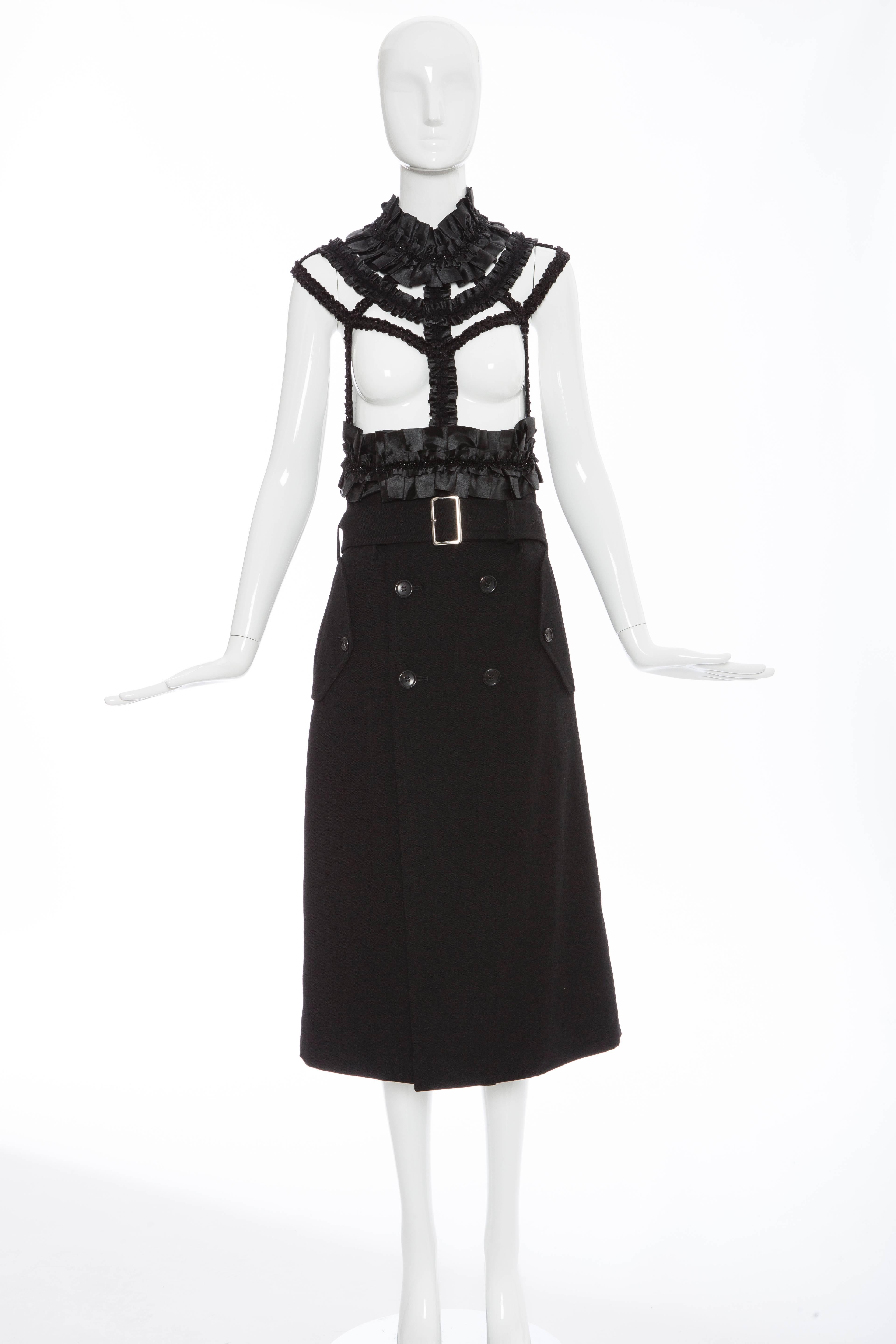  Comme des Garçons, Autumn-Winter 2008 black wool and satin harness dresss featuring black satin ribbon gathered at harness, neck, and waist band and attaches to a faux double breasted mid length skirt. 

Small
 Bust 29