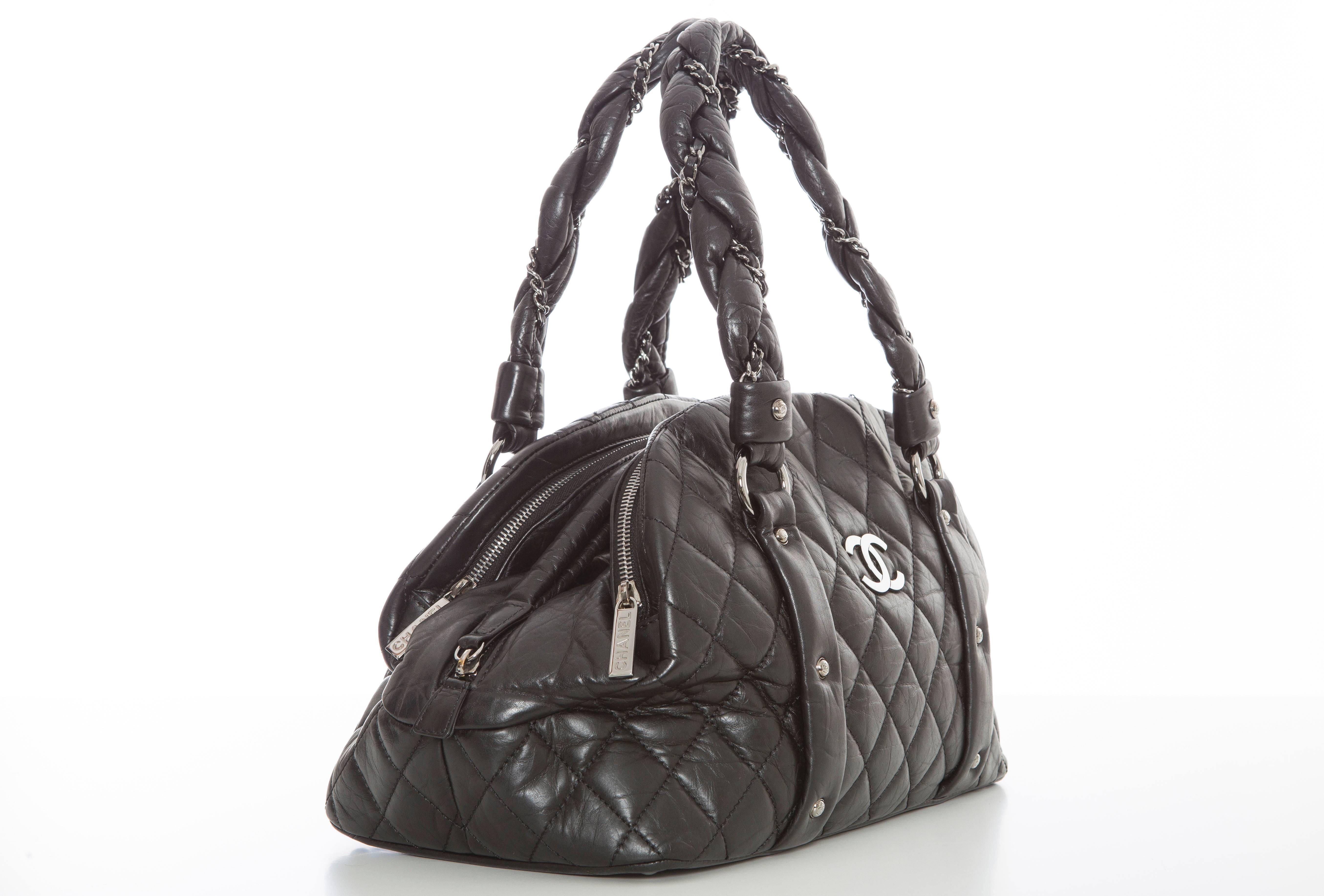  Chanel Lady Braid Bowler bag, Autumn-Winter 2006, black quilted leather with gunmetal hardware, chain-link and leather shoulder straps, dual rolled shoulder straps, two exterior pockets with zip closures, black woven interior lining, single pocket