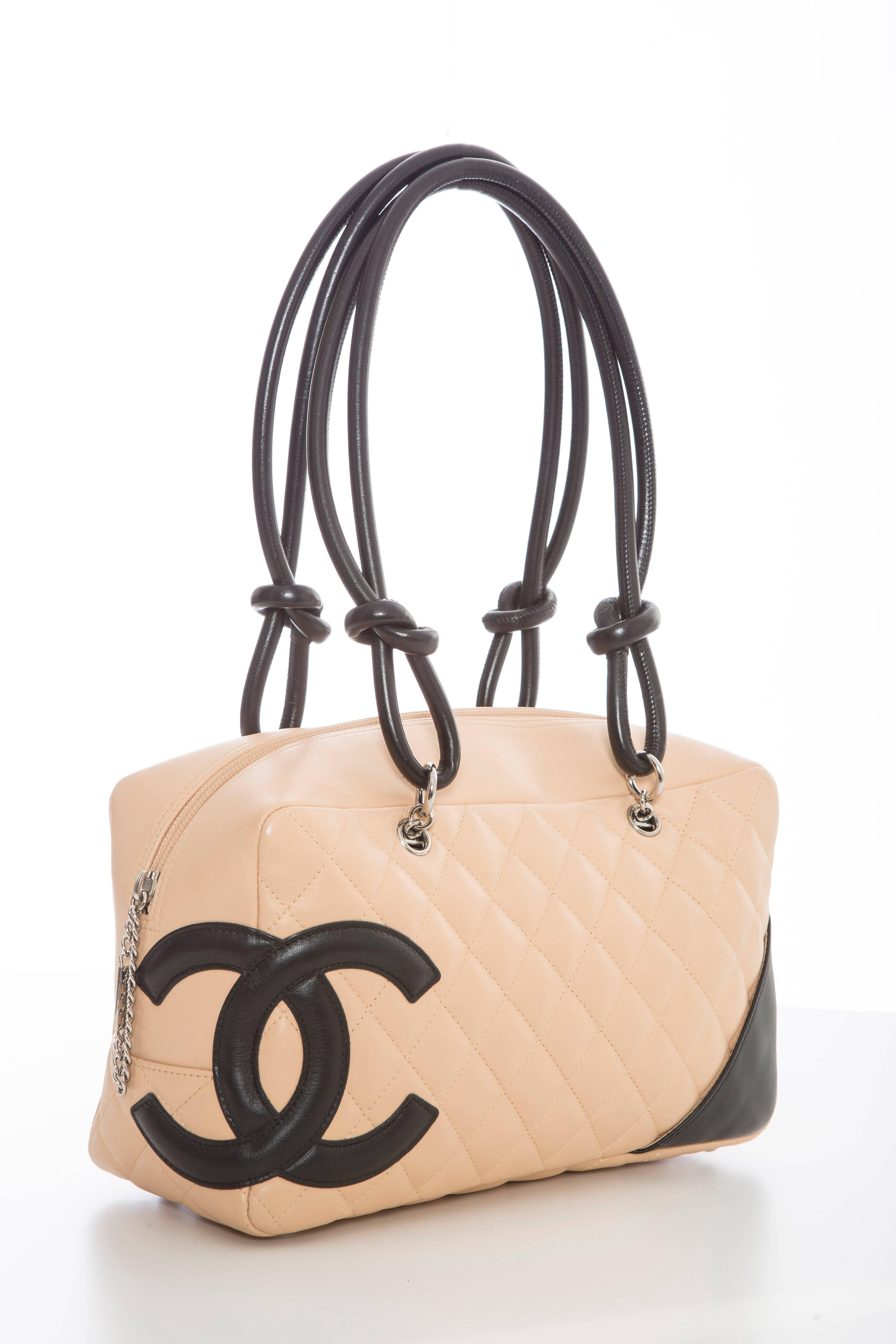 Chanel Ligne Cambon Bowler Bag, circa 2005, quilted leather with silver-tone hardware, tonal stitching throughout, dual rolled handles featuring knot accent, stitched CC logo at front face, rear face slit pocket, black logo printed woven lining,