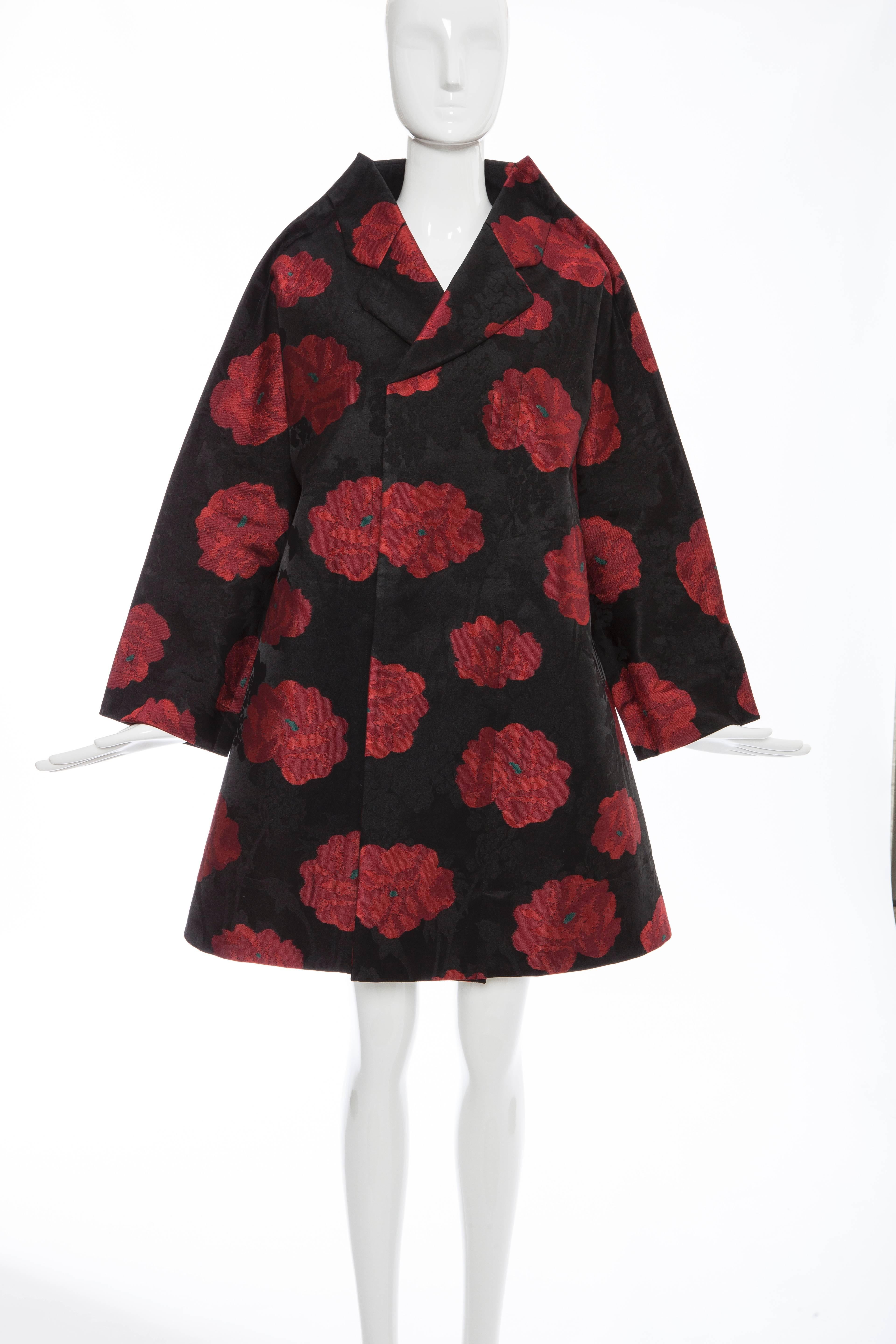 Comme des Garçons, Autumn-Winter 2012, floral jacquard swing coat featuring notched lapels, pockets at interior and sash tie closure at front.

Japan: Small

62% Polyester, 38% Rayon; 100% Polyester; 100% Cotton
Measurements: Bust 48”, Waist
