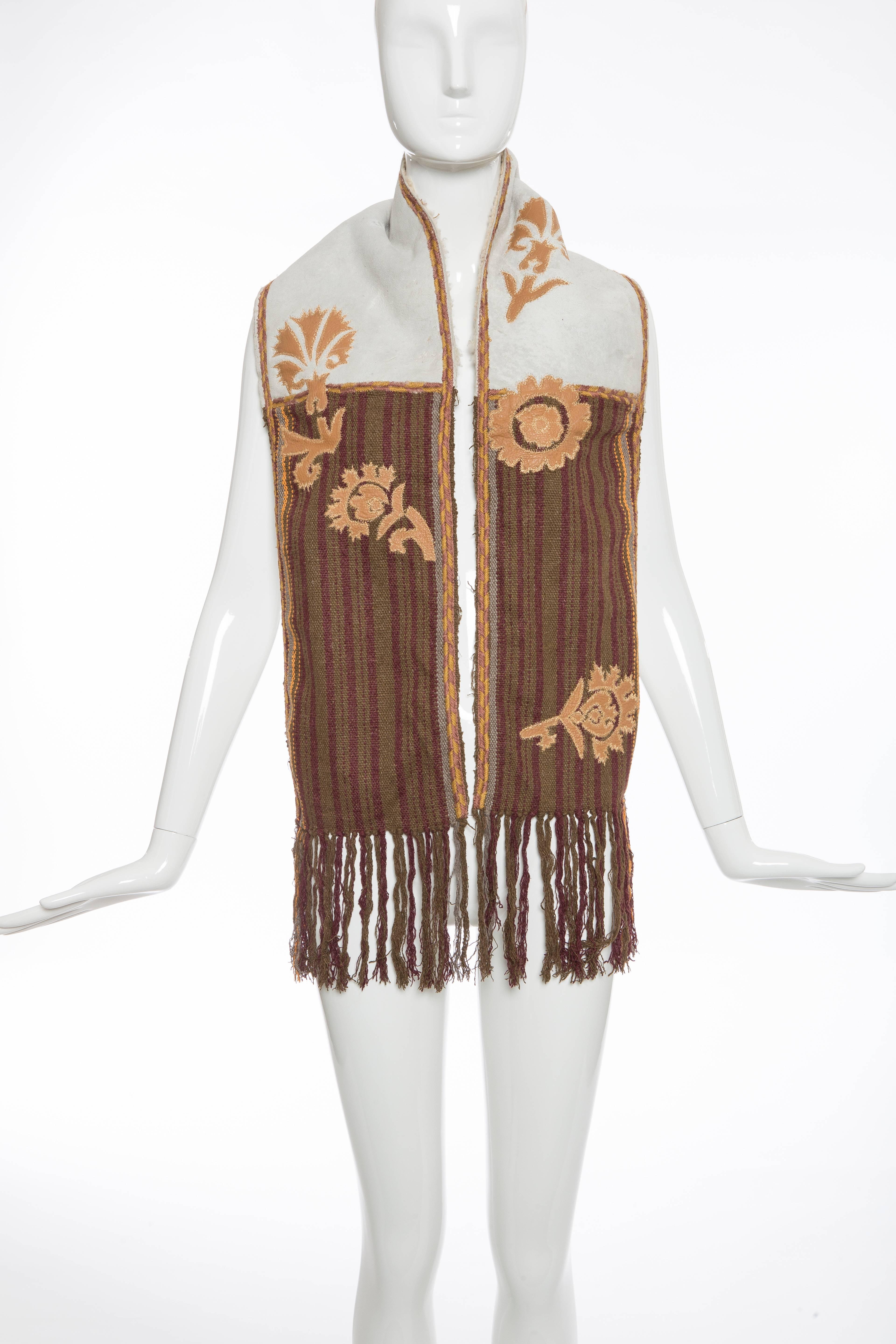 Dries van Noten, Autumn-Winter 2002, silk and wool-blend scarf with embroidery throughout, suede panel featuring shearling trim and fringe trim at ends.

35% Silk, 35% Wool, 30% Leather
Measurements: Length 60