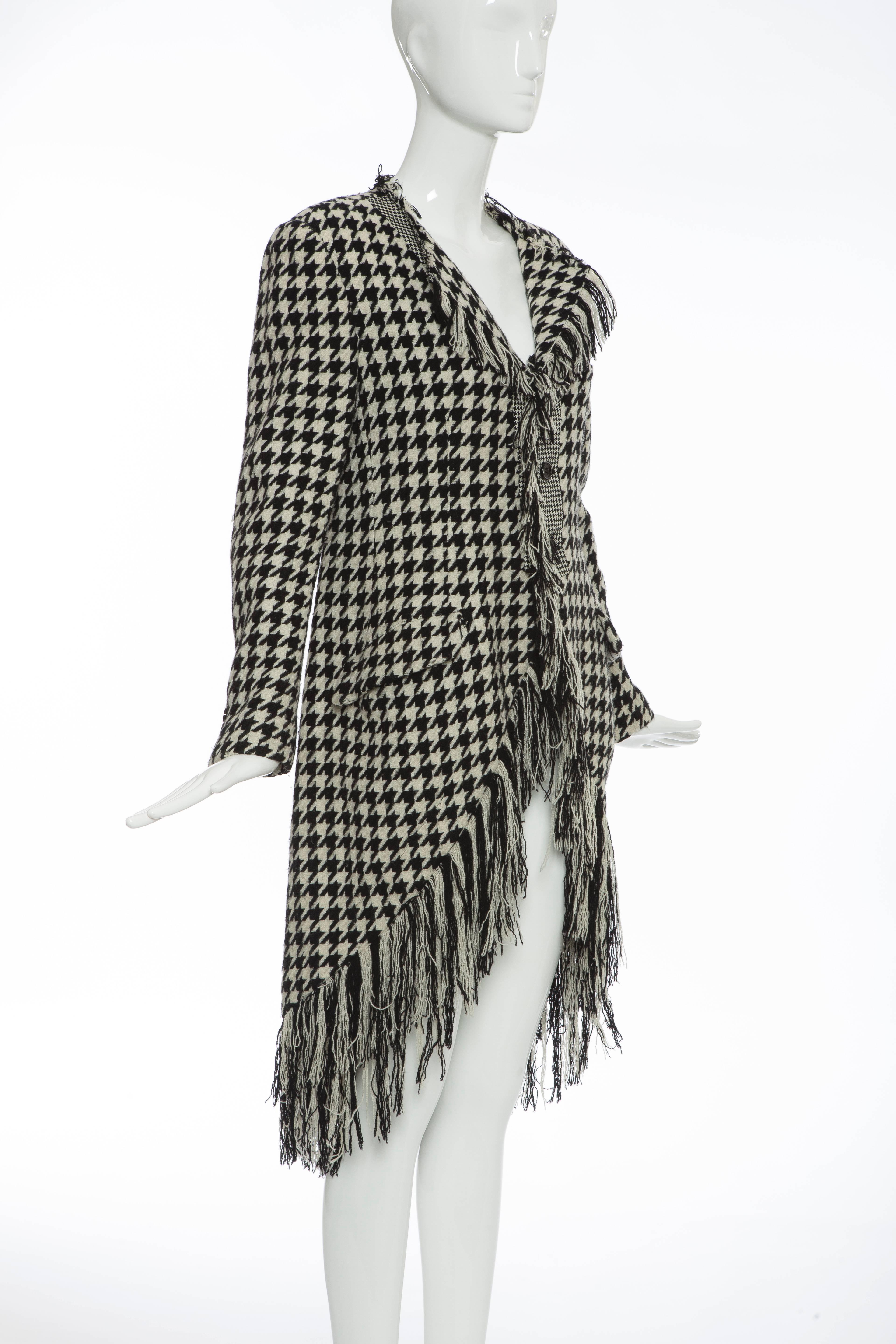 Yohji Yamamoto, Autumn/Winter 2003, black and white wool tartan fringed jacket with dual front flap pockets, front welt pocket, front button closures and fully lined.

Japan: Medium

Measurements: Bust 36”, Waist 32”, Shoulder 17.5”, Length