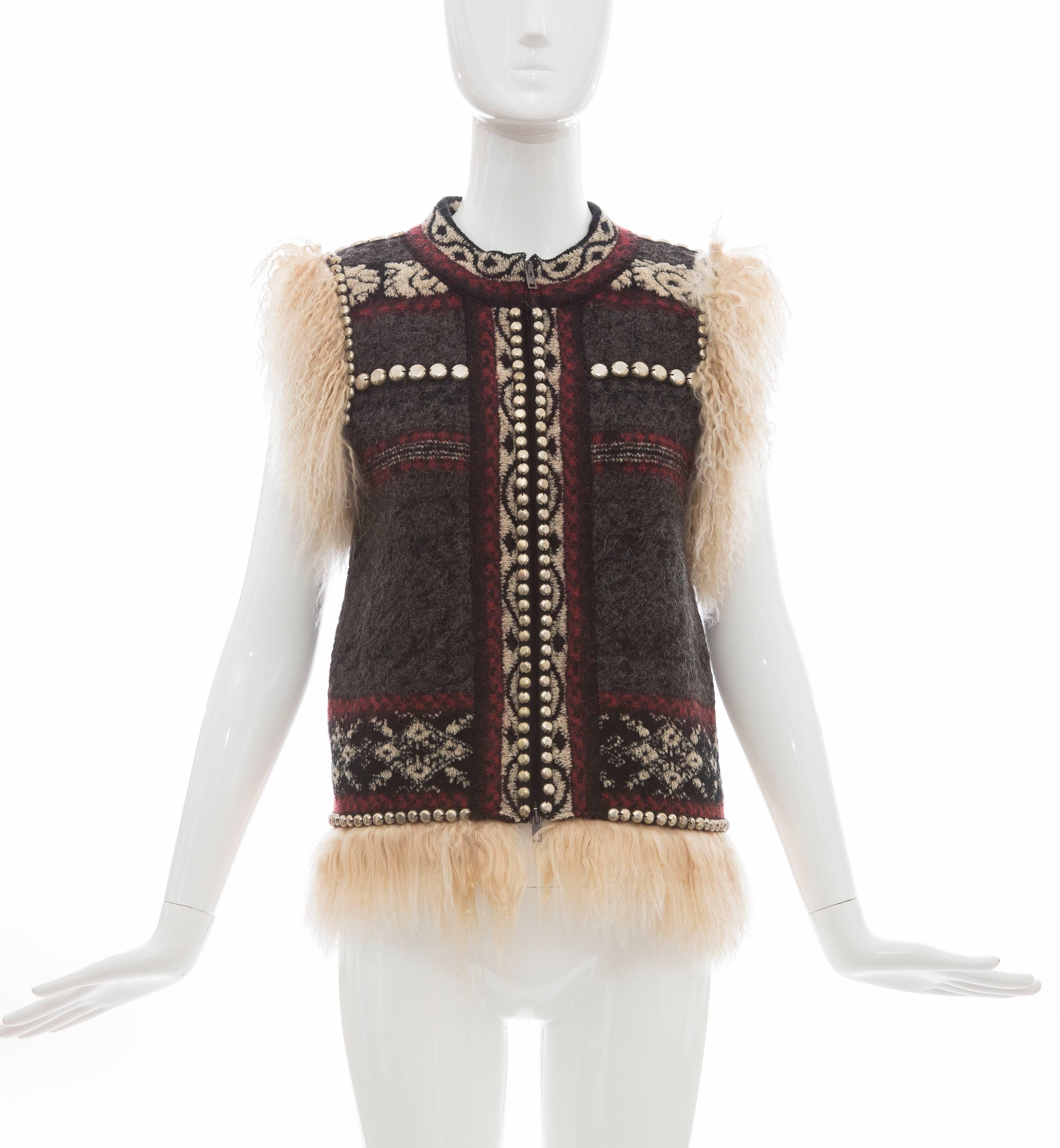 Jean Paul Gaultier, Autumn-Winter 2010 wool-blend vest with Mongolian fur trim throughout, brass stud embellishments at trim, pattern throughout and concealed two-way zip closure at center front.

63% Virgin Wool, 7% Viscose, 6% Mohair, 5%