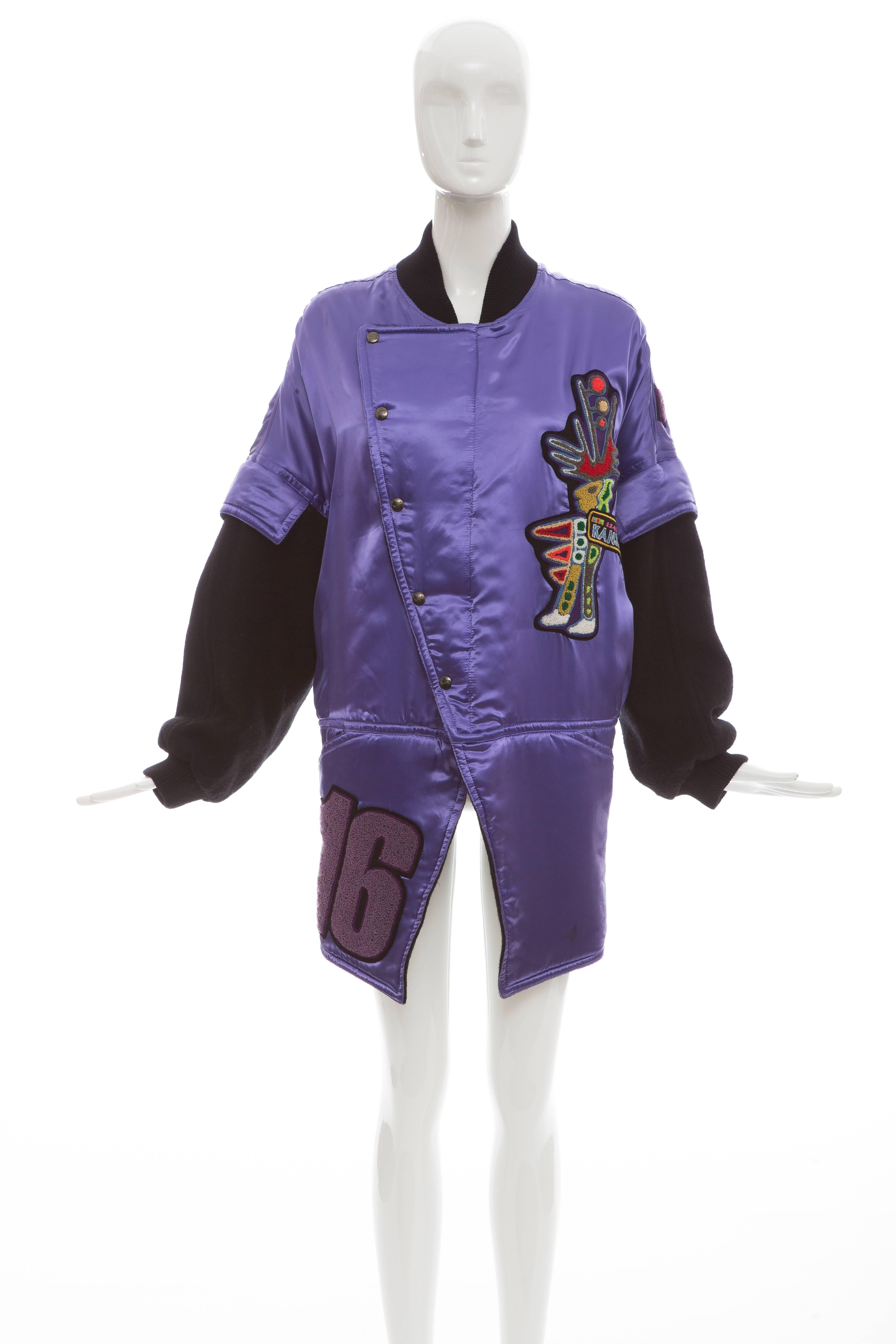 Kansai Yamamoto, circa 1980's, purple satin jacket, snap and zip front, two front pockets, wool sleeves and appliquéd patches.

Japan: Small