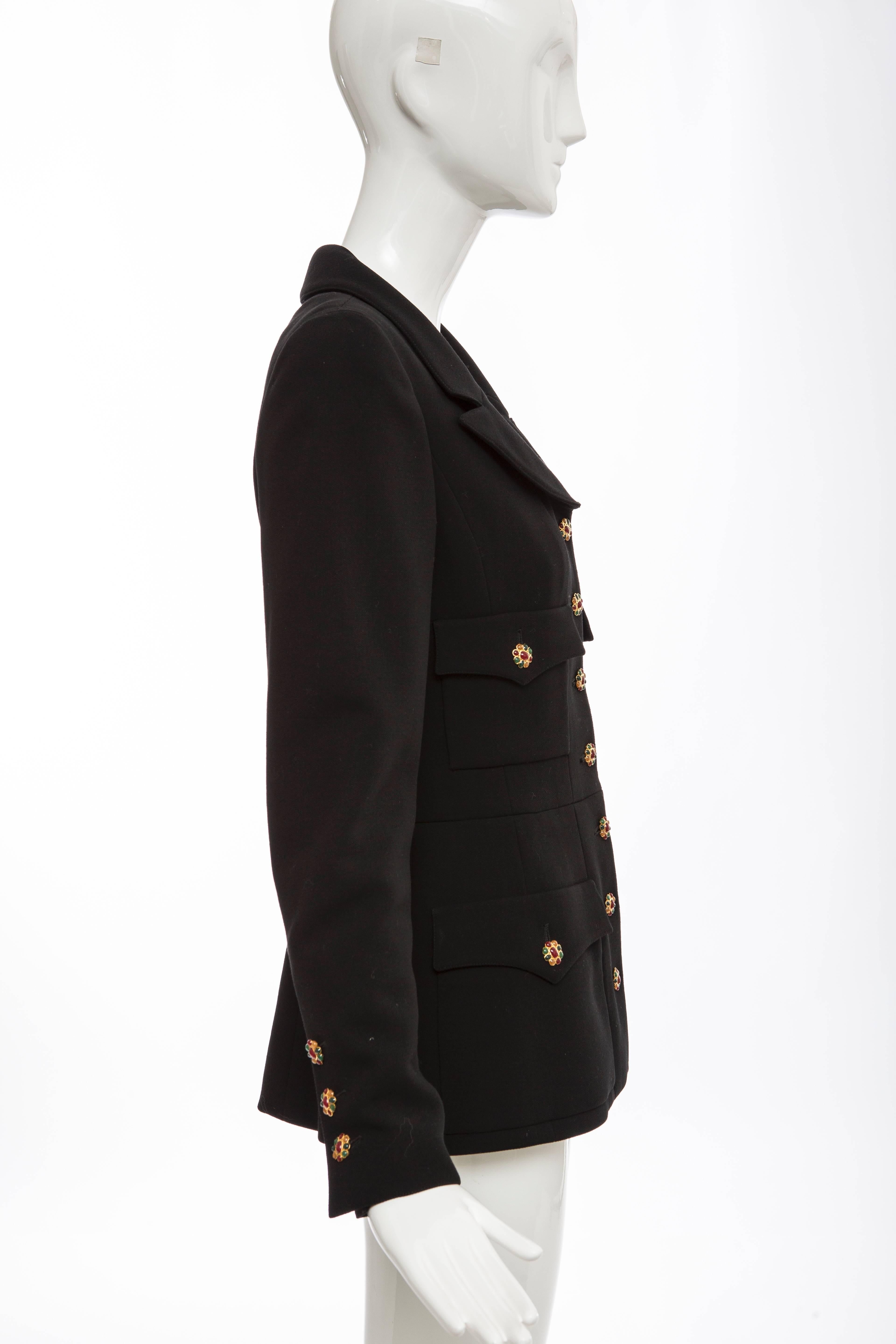 Chanel, Autumn-Winter 1996, black wool jacket featuring structured shoulders, four flap pockets, gold-tone chain link accent at interior hem, gripoix button closures at center front and fully lined in silk.

FR.40
US.8

Bust 36”, Waist 26”, Shoulder