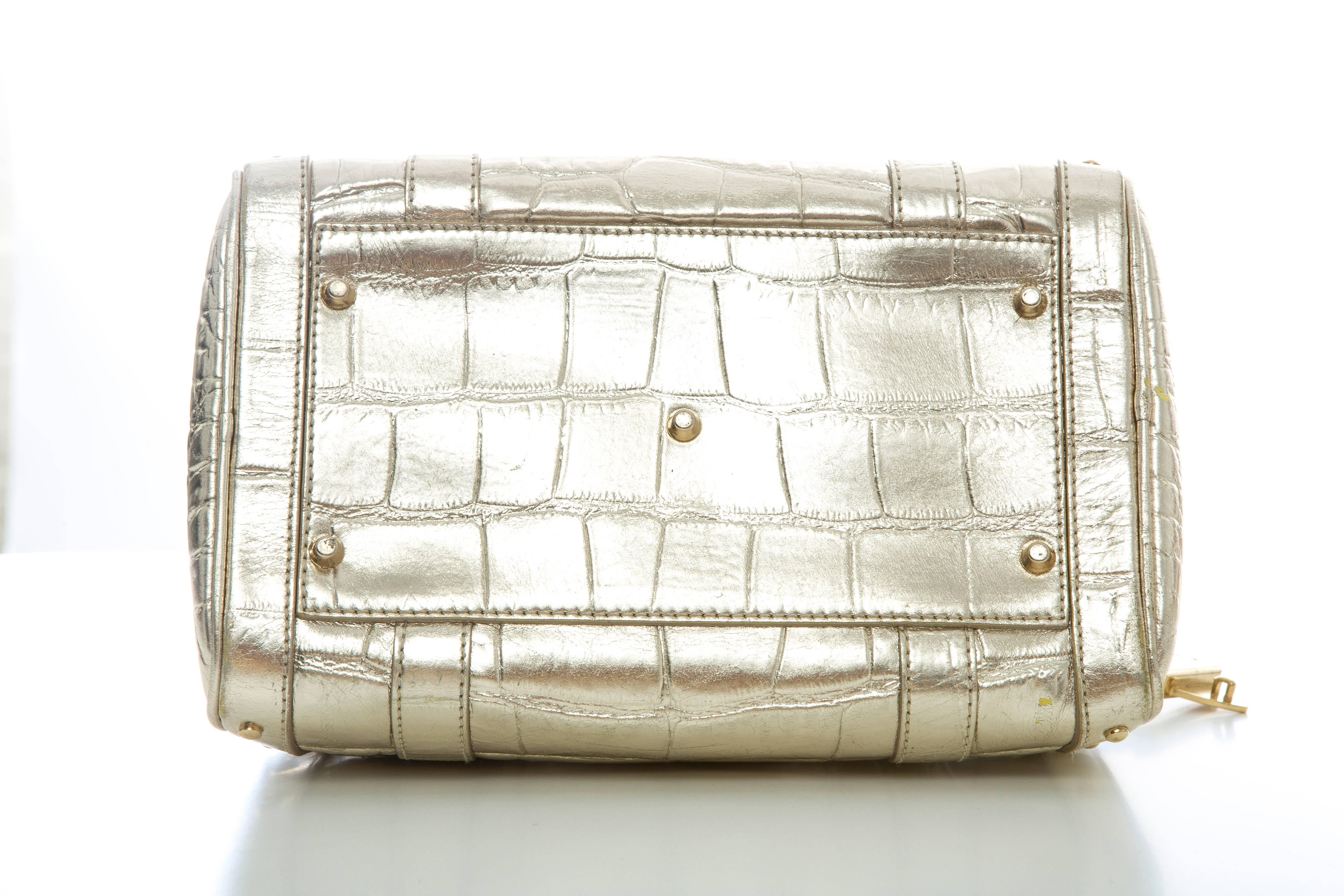Versace Madonna Embossed Metallic Gold Leather Top Handle Handbag In Excellent Condition In Cincinnati, OH