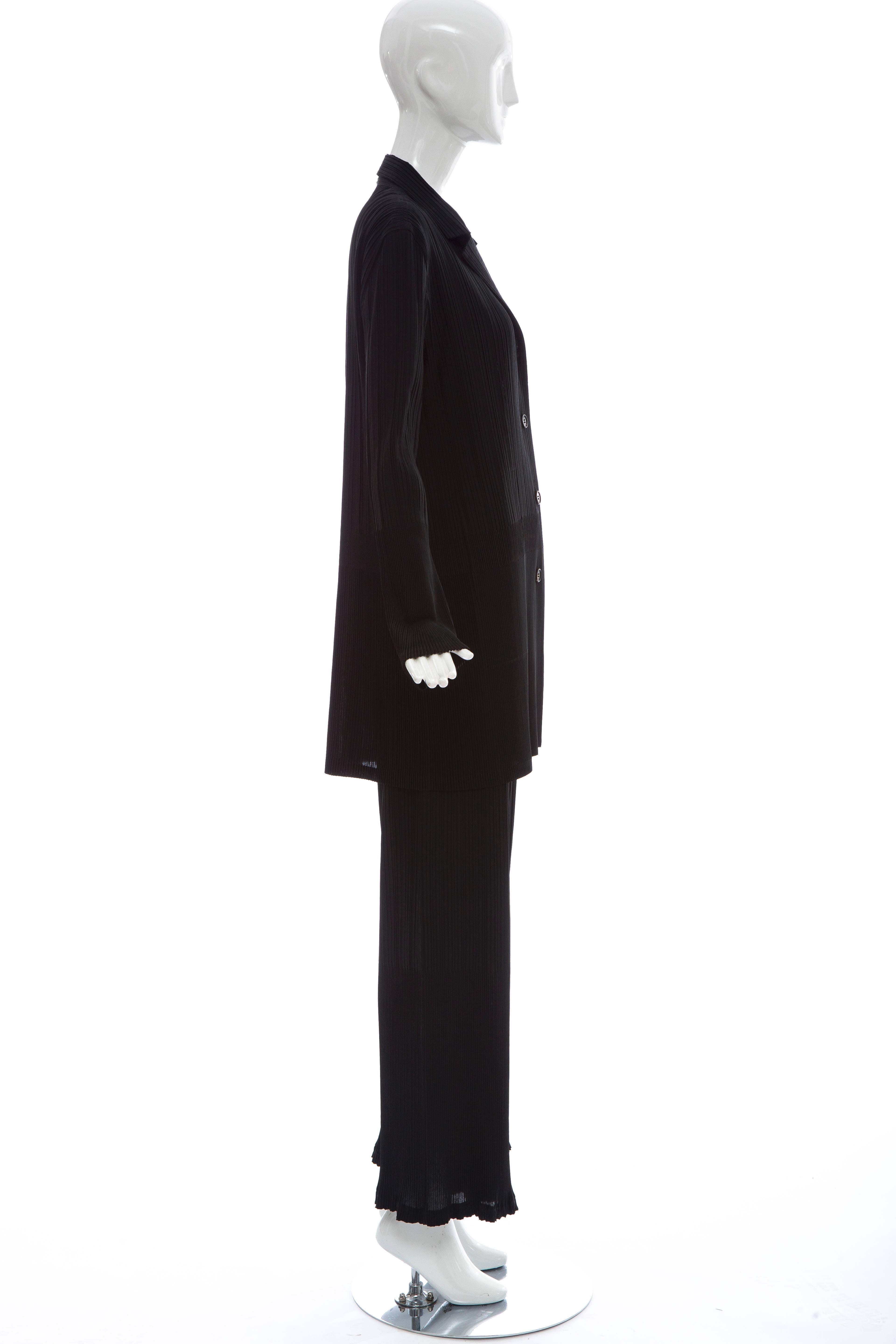 Issey Miyake, White Label, black pleated polyester button front elastic waist pant suit.

Japan: Size 4

Jacket: Bust 48, Waist 44, Length 33.5
Pant: Waist 34, Hips 48, Length 40 