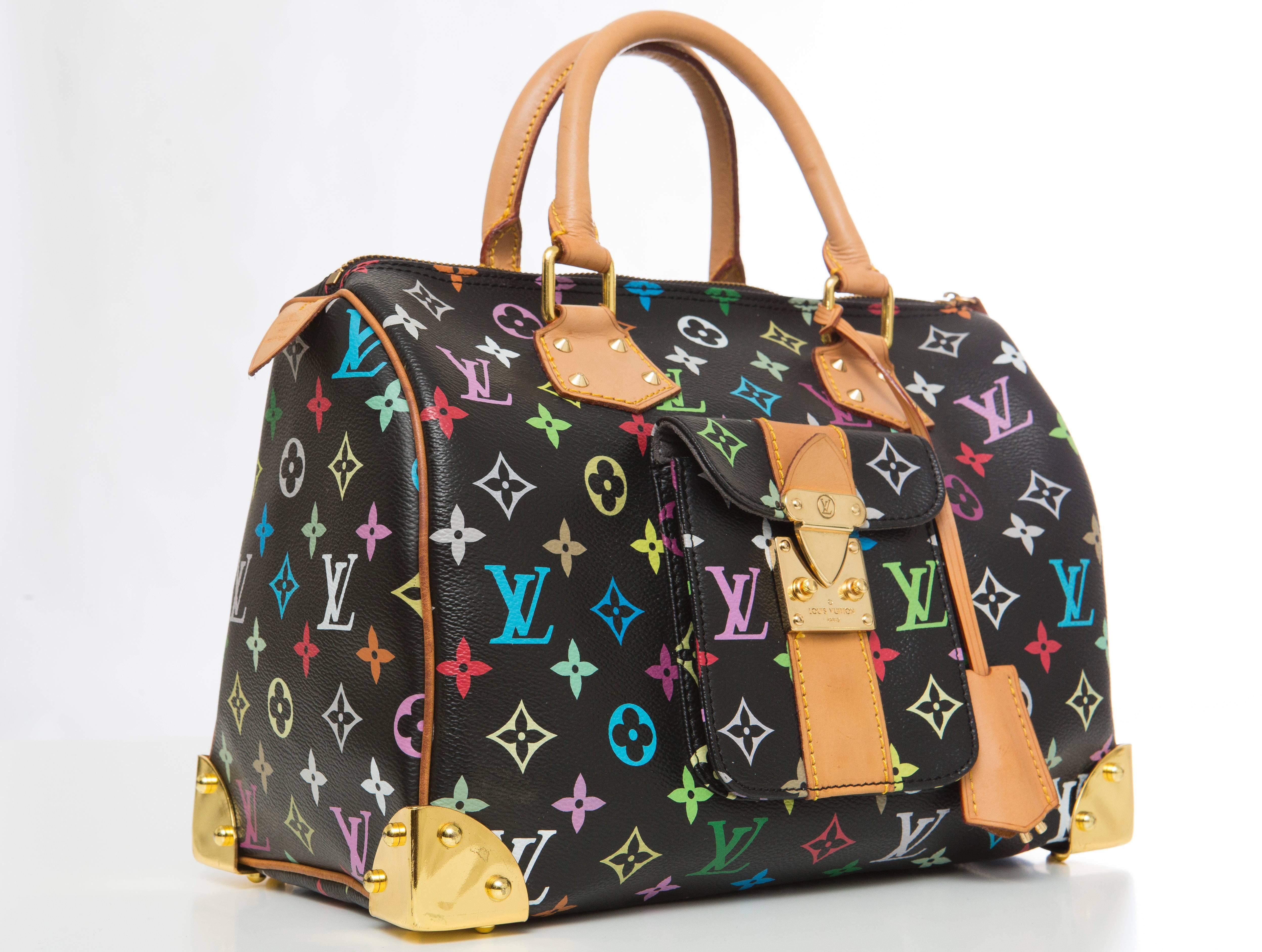 Louis Vuitton, Speedy 30, limited edition hand bag from the Takashi Murakami Collection. Black and multicolored monogram coated canvas with brass hardware, S-lock closure at side gusset, tan vachetta leather trim, single pocket with S-lock closure