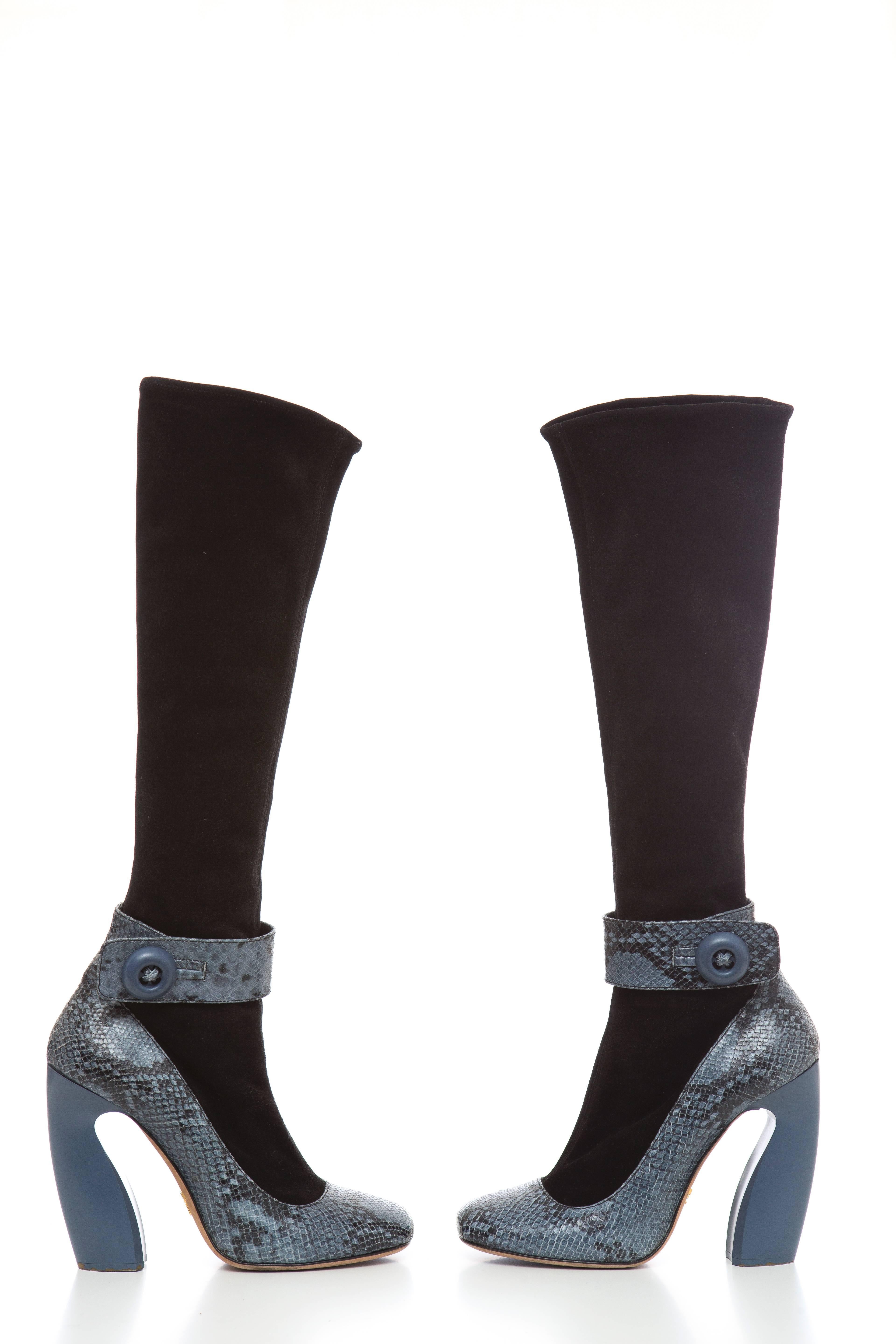 Prada, Autumn-Winter 2011, round-toe knee-high boots with python trim, sculpted heels, button closures at ankles and zip closures at sides.

IT. 9
US. 9

Calf Circumference: 12"
Shaft: 16"
Heels: 4.75"