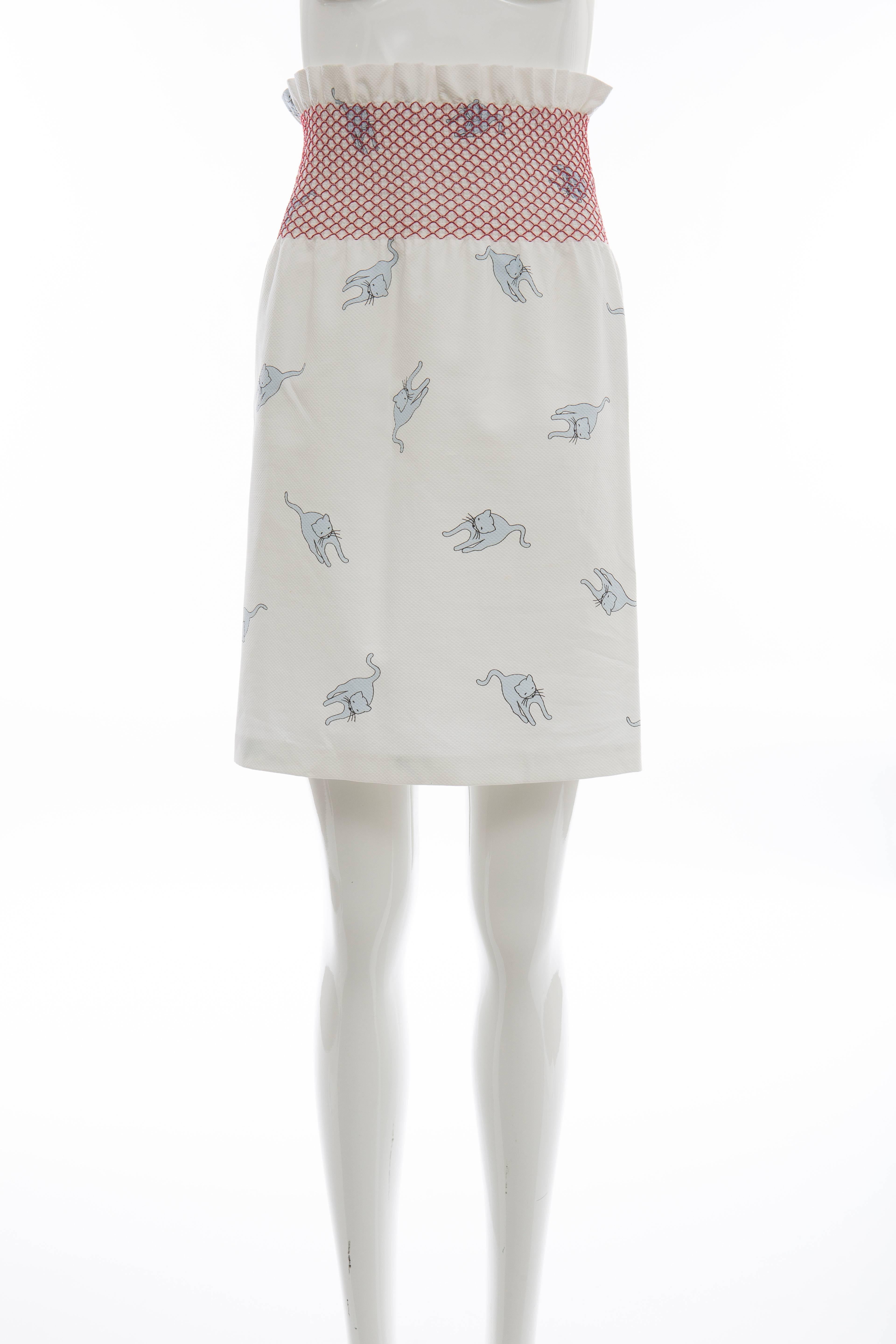 Miu Miu, Spring-Summer 2010, cotton skirt with cat print throughout and red smocked waistband.

IT.38
US. 2

Waist: 24