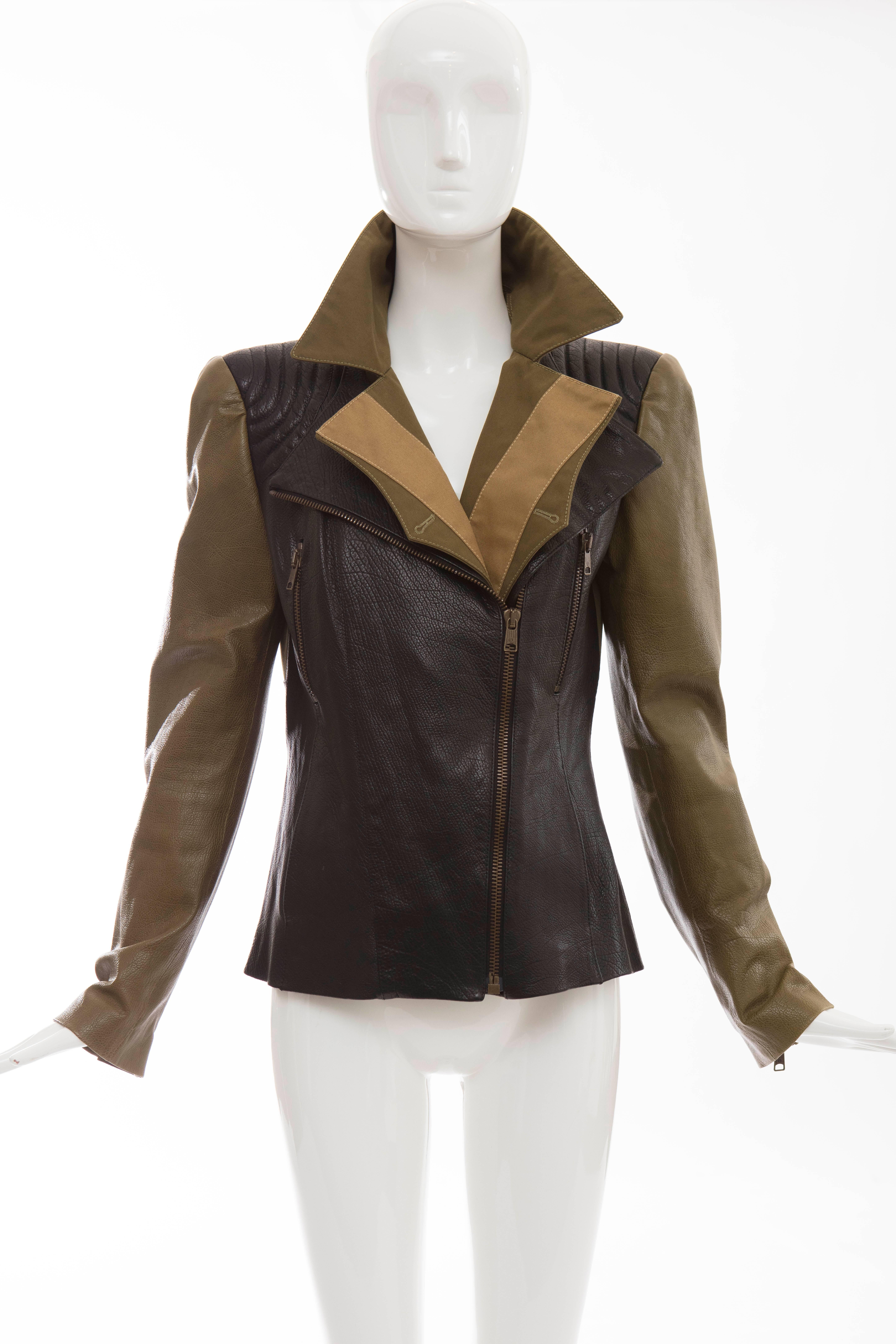Alexander McQueen, olive green and black leather jacket, olive green cotton canvas panels, asymmetrical front zip closure, four front pockets with two zip, zip leather sleeves and silk lined.

EU. 44
US. 8

Bust 35, Waist 32, Sleeve 25, Length 23.5