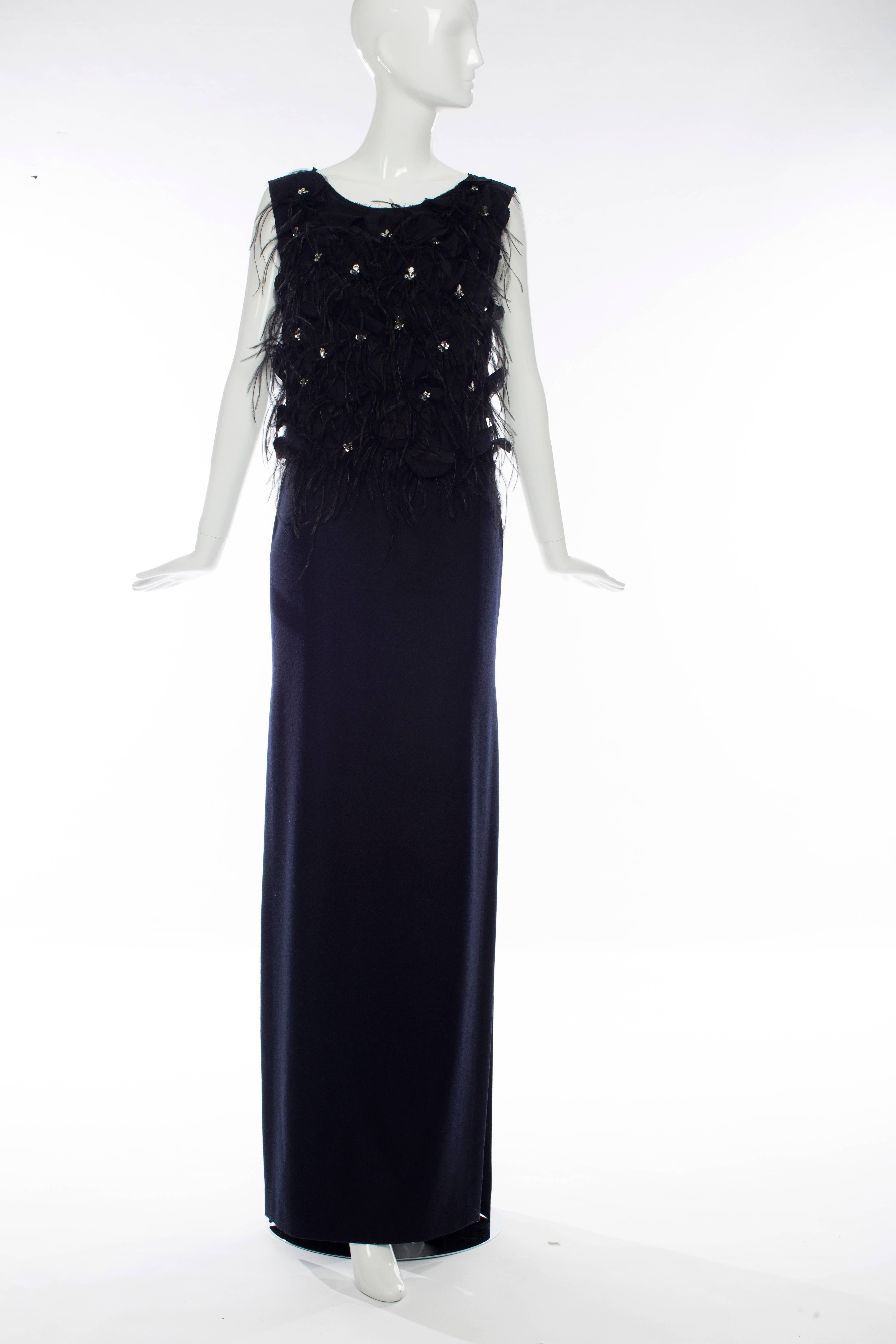Dries Van Noten, Fall circa 2013, navy blue wool and black silk chiffon sleeveless evening dress, feather and prong set crystal and sequin embellished bodice, sheer back, skirt has slit at sides with two front pockets and fully lined.
