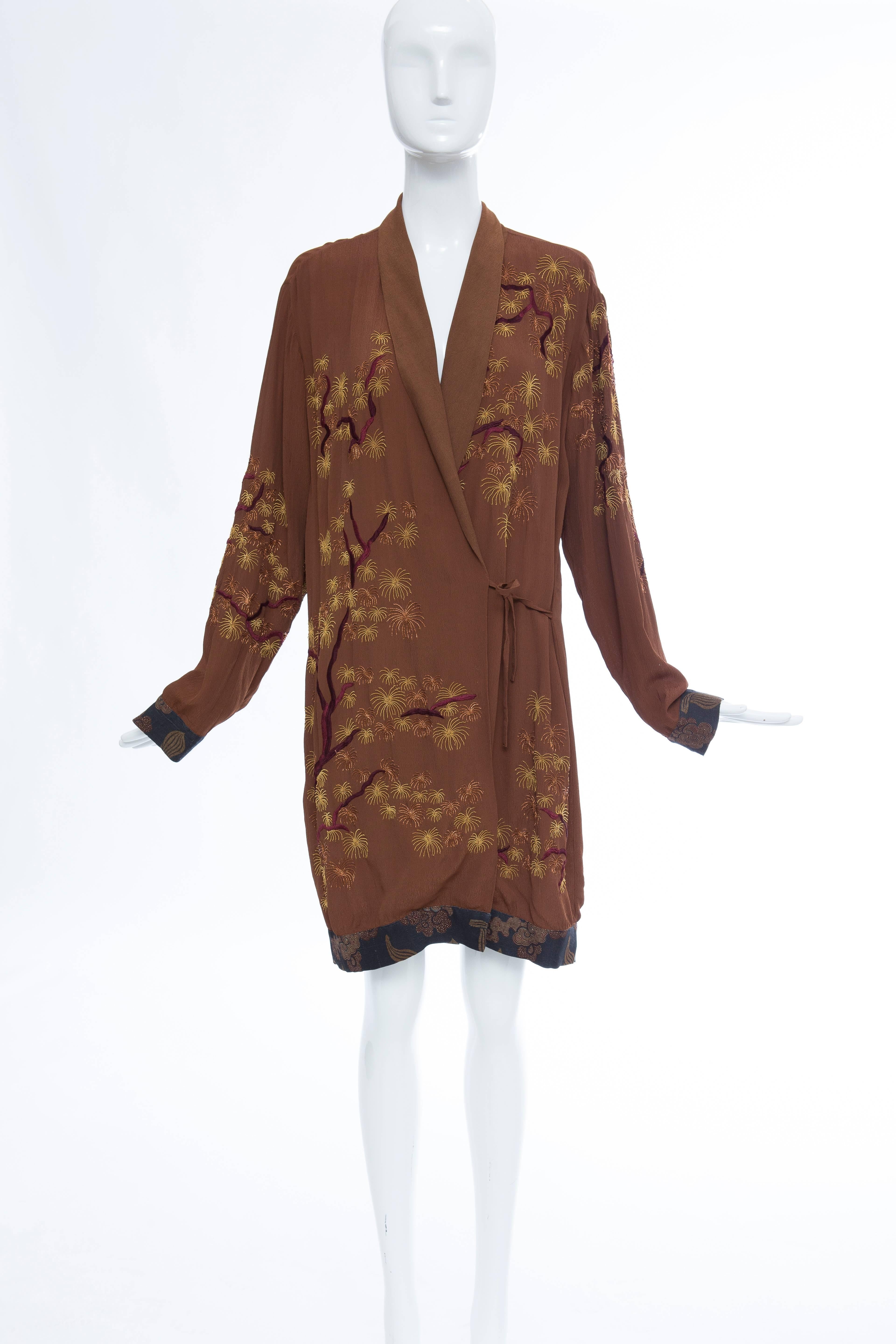 Dries Van Noten embroidered kimono jacket with printed cuffs and hem and self tie closures at waist.

XS

Bust: 40, Waist 37, Length: 37
