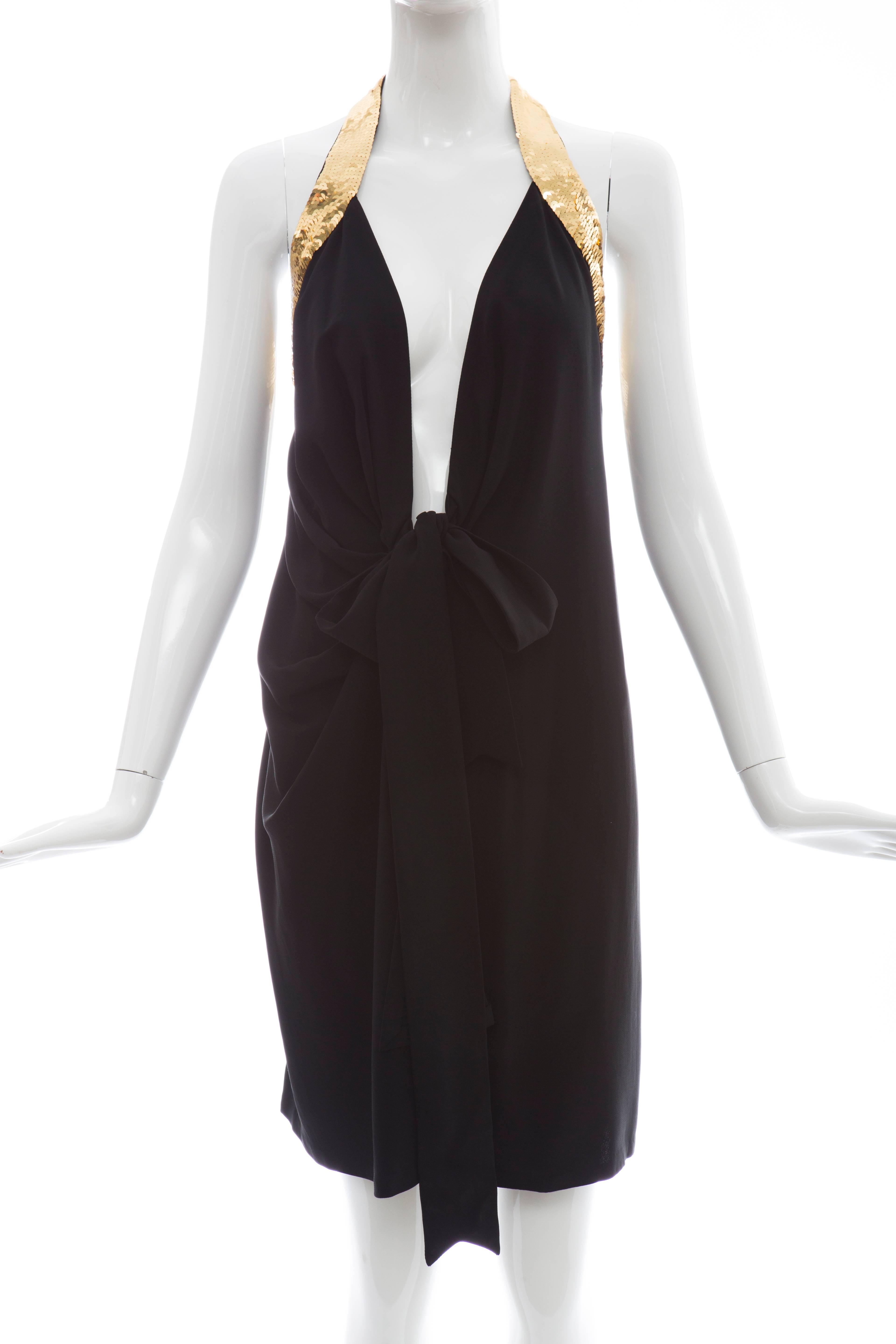 Moschino Couture, circa 1993, black rayon acetate evening dress with back gold sequin peace sign.

US. 8

Bust: 32