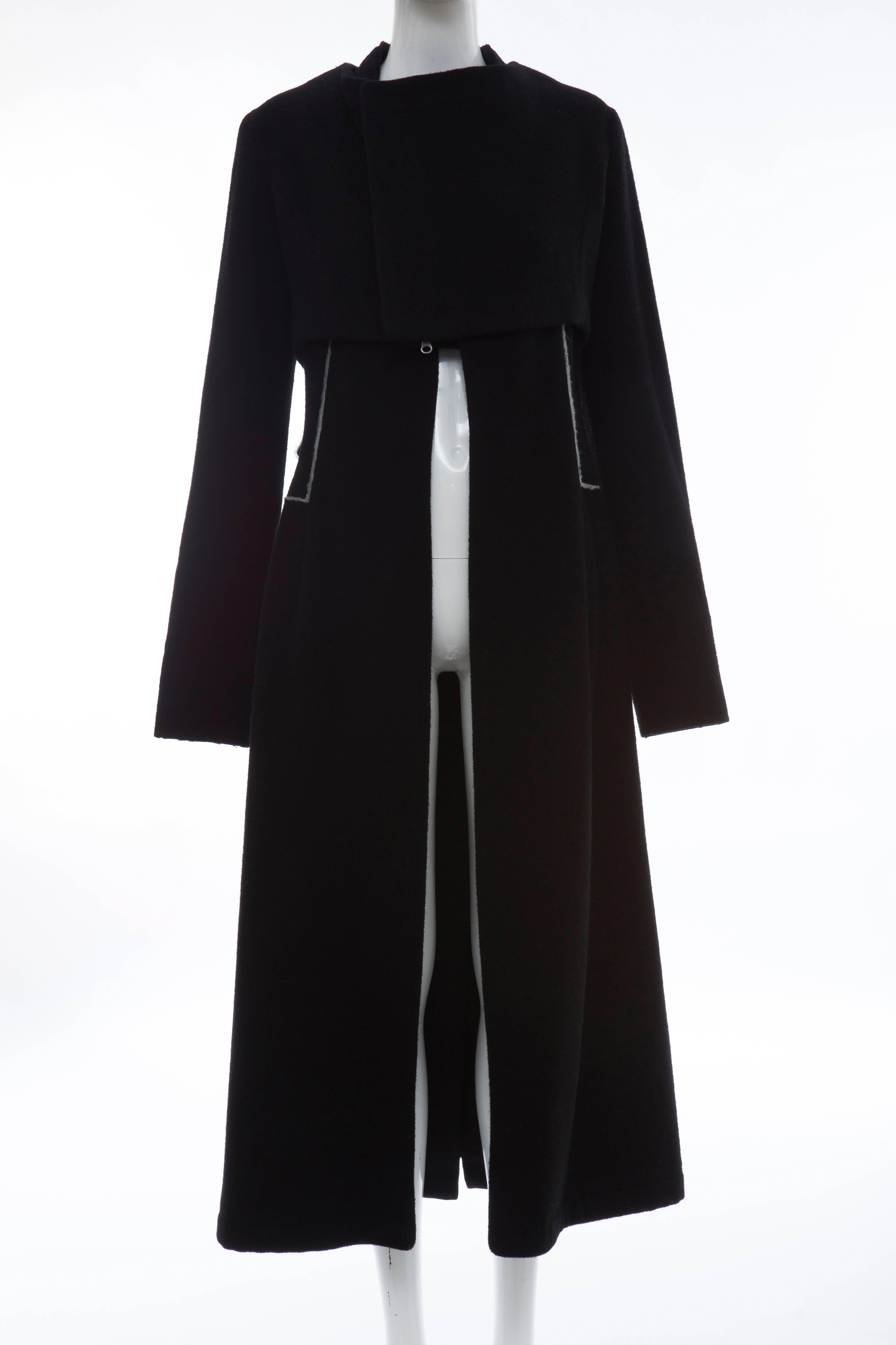 Yohji Yamamoto black wool zip front jacket and vest set. Jacket features round neck, high-low hem, raw-edge trim and two-way zip closure at front. Vest features fold-over collar, raw-edge trim and open front.

Japan Size 1

Bust 36