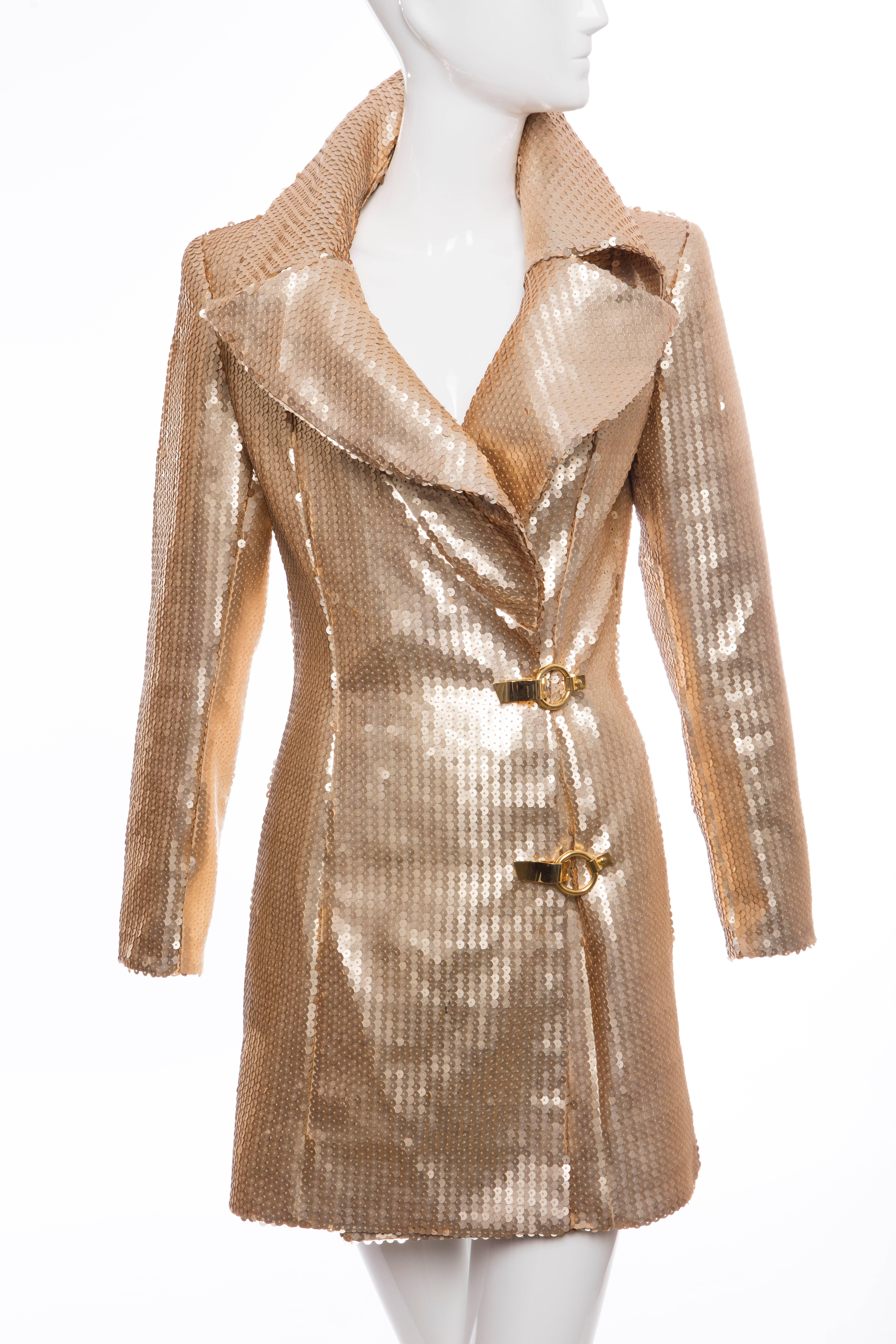 Claude Montana, circa 1980's, matte gold sequin jacket, two front pockets, gold-tone closures and fully lined.

US. 6