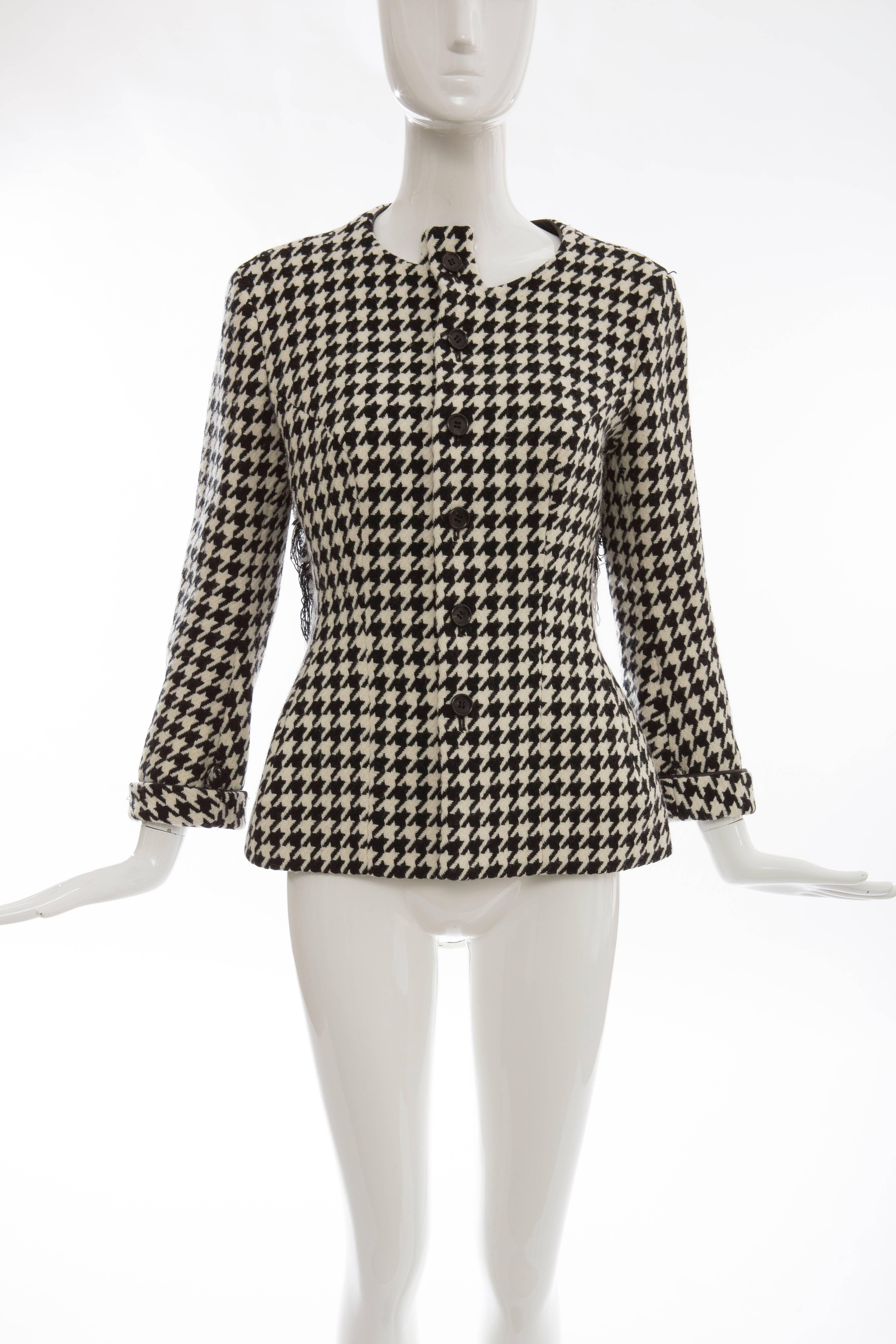 Yohji Yamamoto, Autumn-Winter 2003 wool jacket with Houndstooth pattern throughout, leather trim, fringe trim at back and front button closures. 

Designer size 2.
Bust: 42
Waist: 40
Shoulder: 17
Length: 26
Sleeve: 29