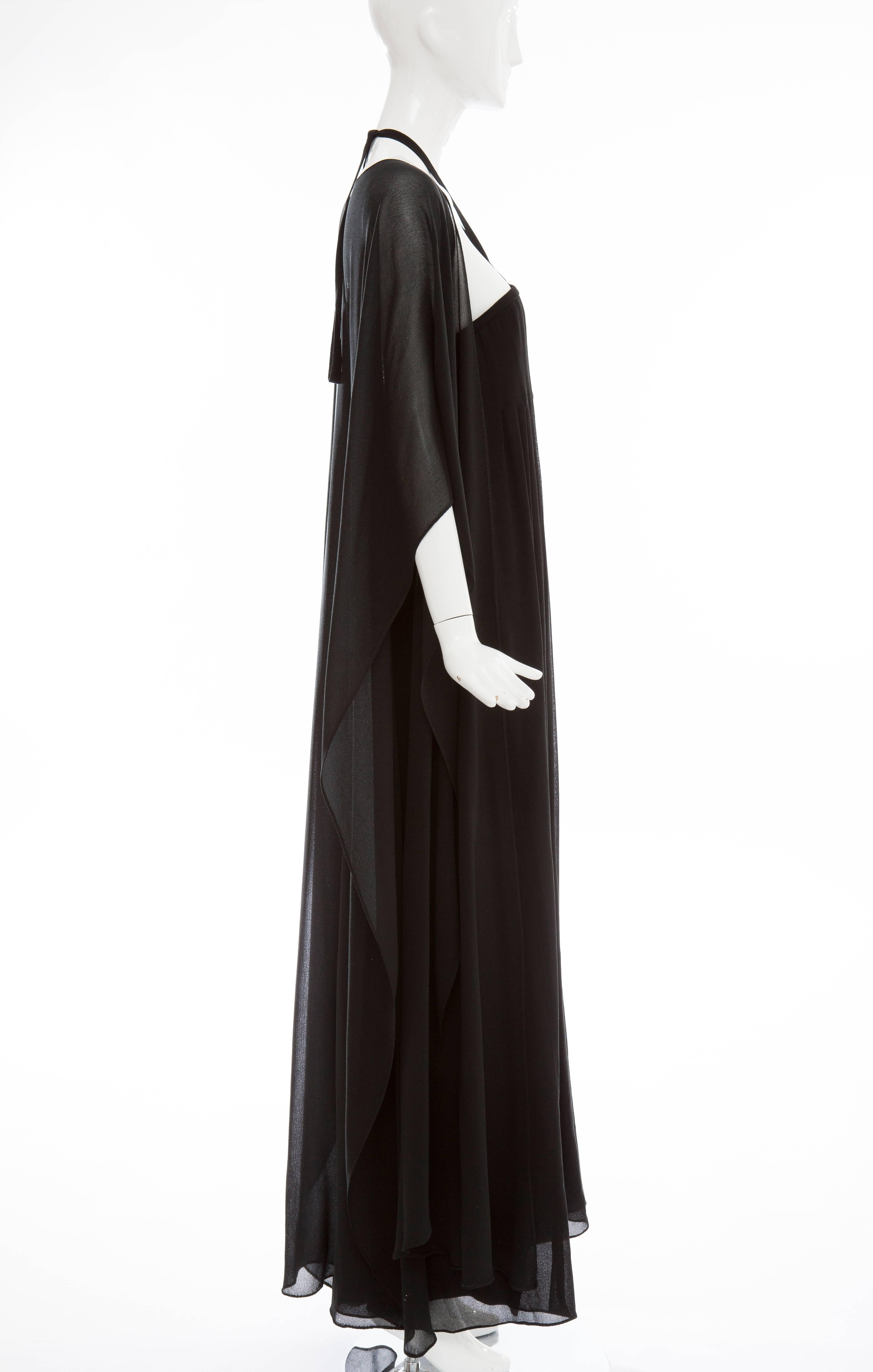Bill Blass, circa 1970's black nun's cloth strapless evening dress, side zip, pleated bodice, fully lined in silk with long silk chiffon wrap.


US. Size 12

Bust: 32, Waist: 50, Hips: 58, Length: 52