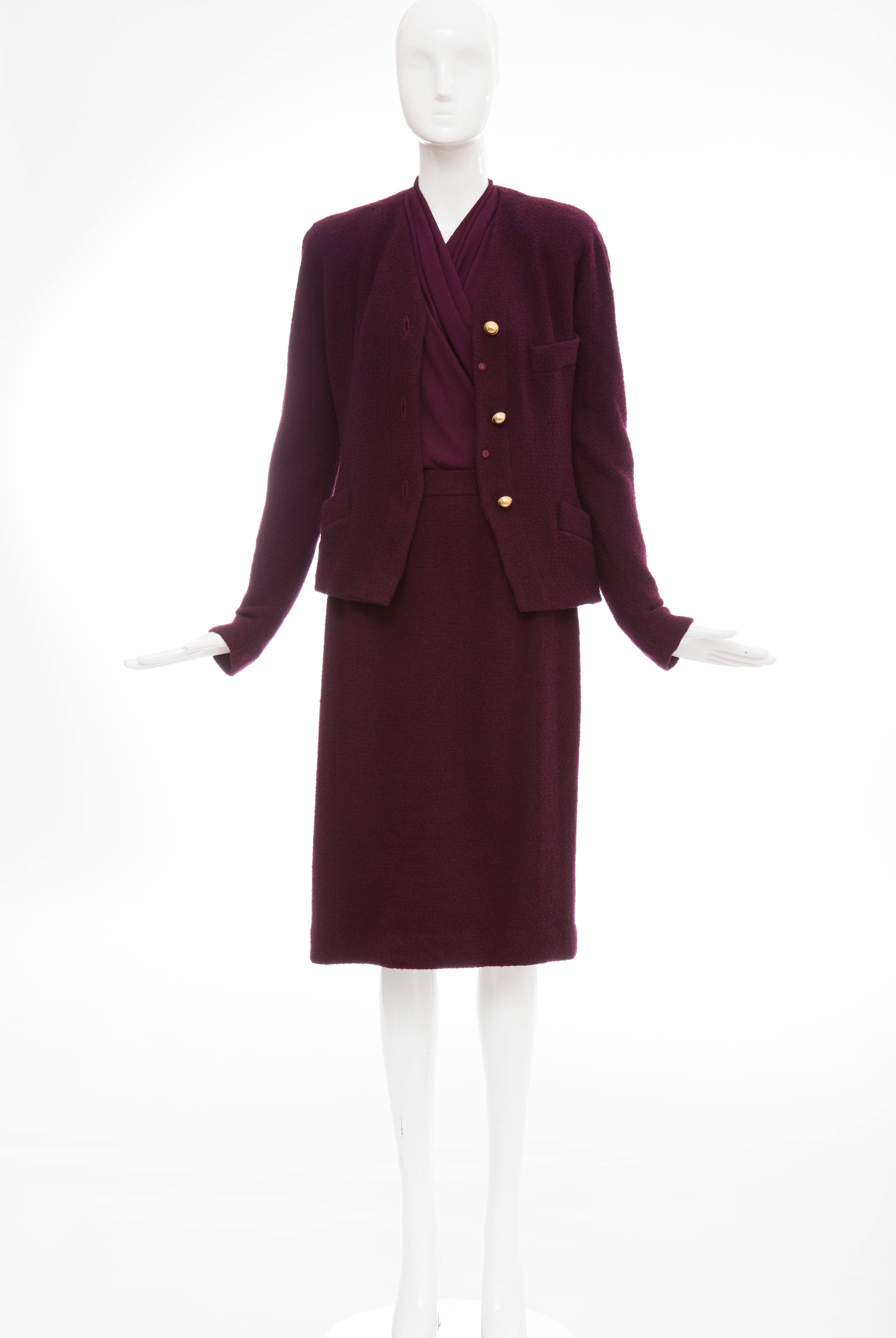 Donna Karan, circa 1980's eggplant stretch wool nylon knit three piece skirt suit, button front and snap jacket with two front pockets, bodysuit with back zip, skirt with back zip and fully lined. 


Jacket: US. 12  Bust 38, Waist 31, Length