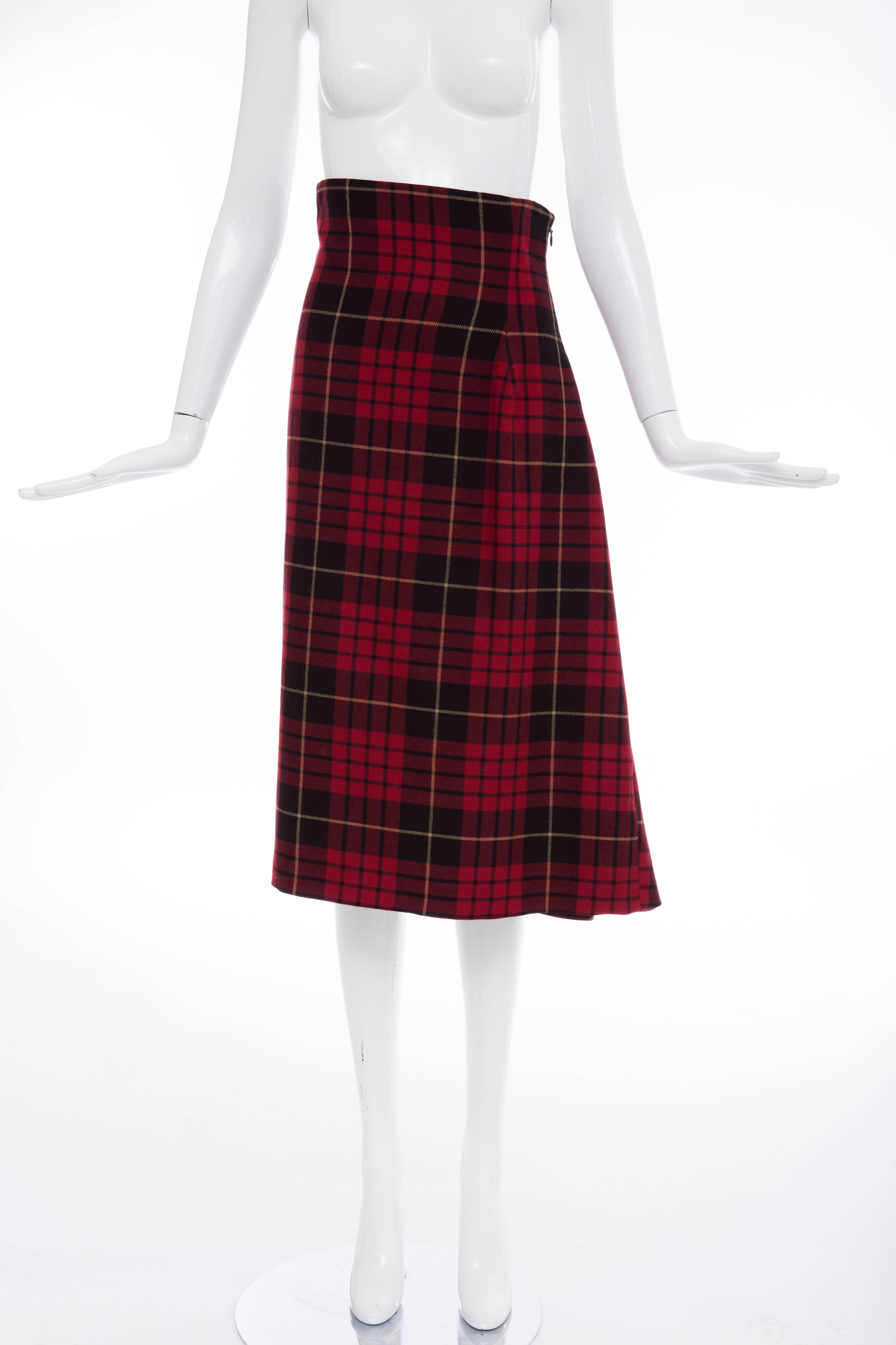 Alexander McQueen, Autumn-Winter 2006, wool red tartan plaid high-waisted skirt with asymmetric pleat, tonal stitching and concealed zip closure at back.

IT. 40
US. 4

Waist: 26, Hip: 38, Length: 32
