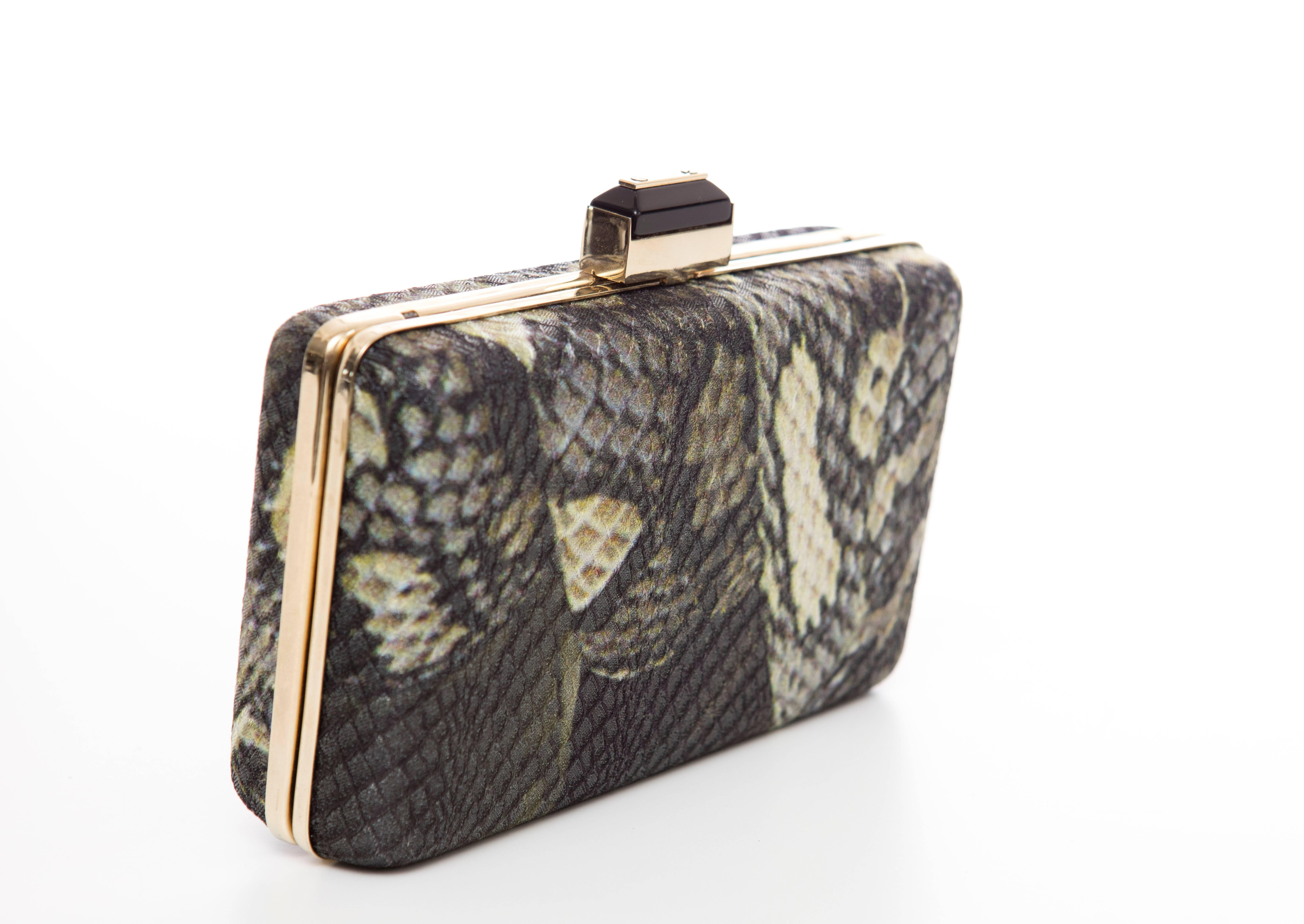 Alber Elbaz for Lanvin, Spring-Summer 2012, python print minaudière clutch with gold-tone hardware, single drop-in shoulder strap, black satin lining and jeweled push-lock closure at top. 

Height 4”, Width 6”, Depth 2”