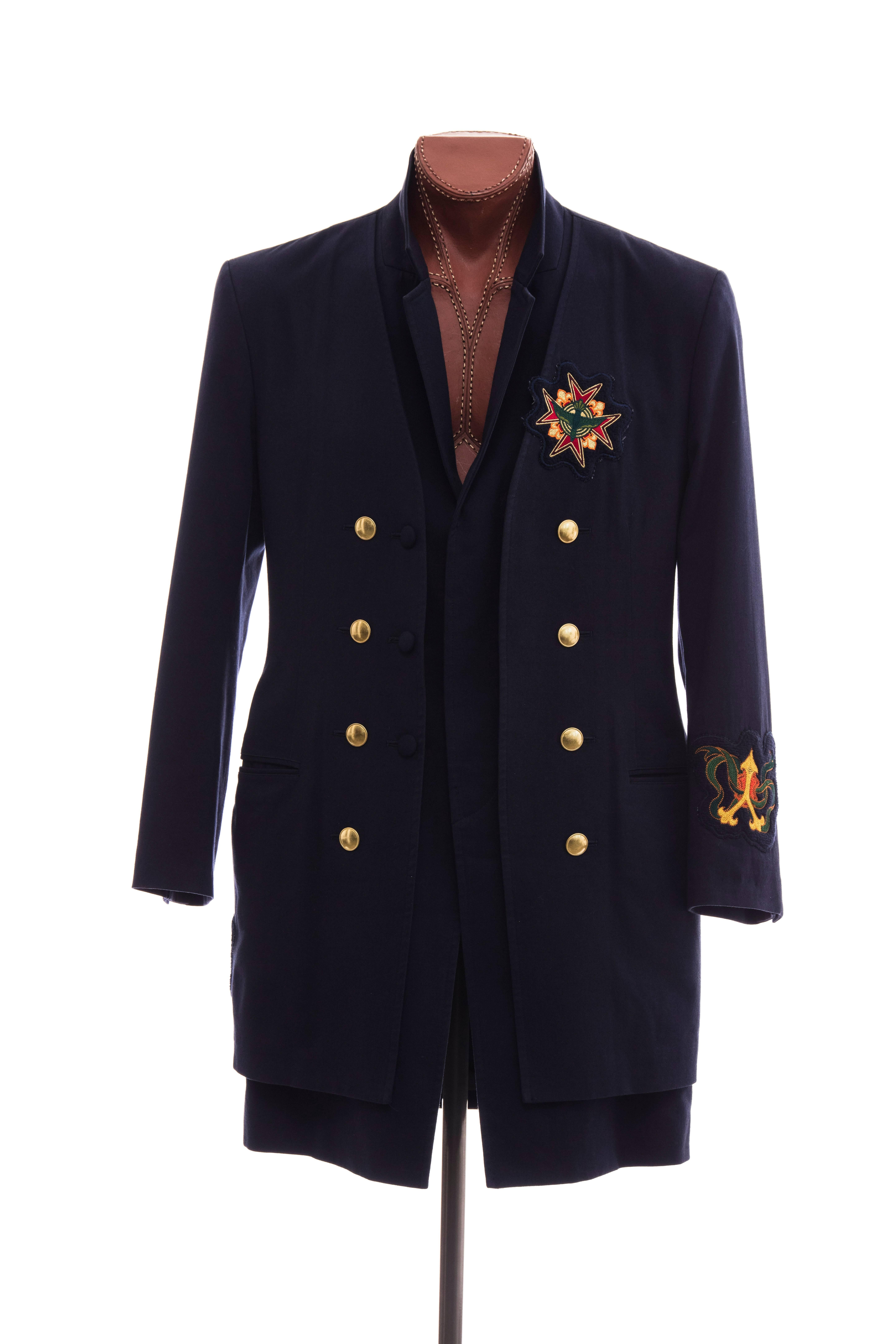 Yohji Yamamoto, Faoo 2012 navy double-breasted military coat with patches at chest, back and left sleeve cuff, two pockets and button closures at front. 

Japan Size 3

Chest 40