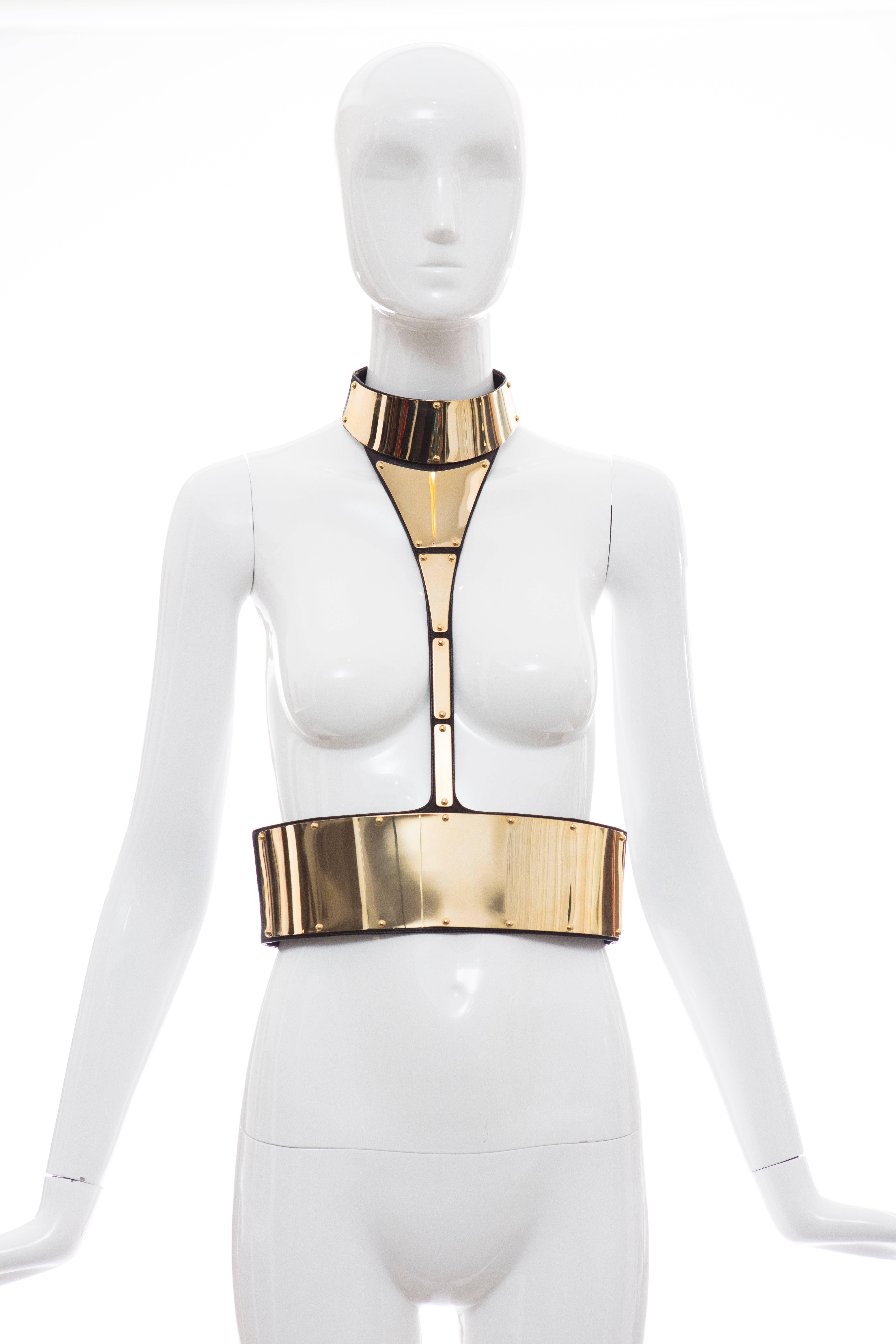  Giuseppe Zanotti body harness with gold-tone metal plates and back black leather and elasticized trim with dual snap closures at nape and center back.

IT. Medium
US. Medium

Measurements: Neck 15", Length 16", Waist 28"

Featured in