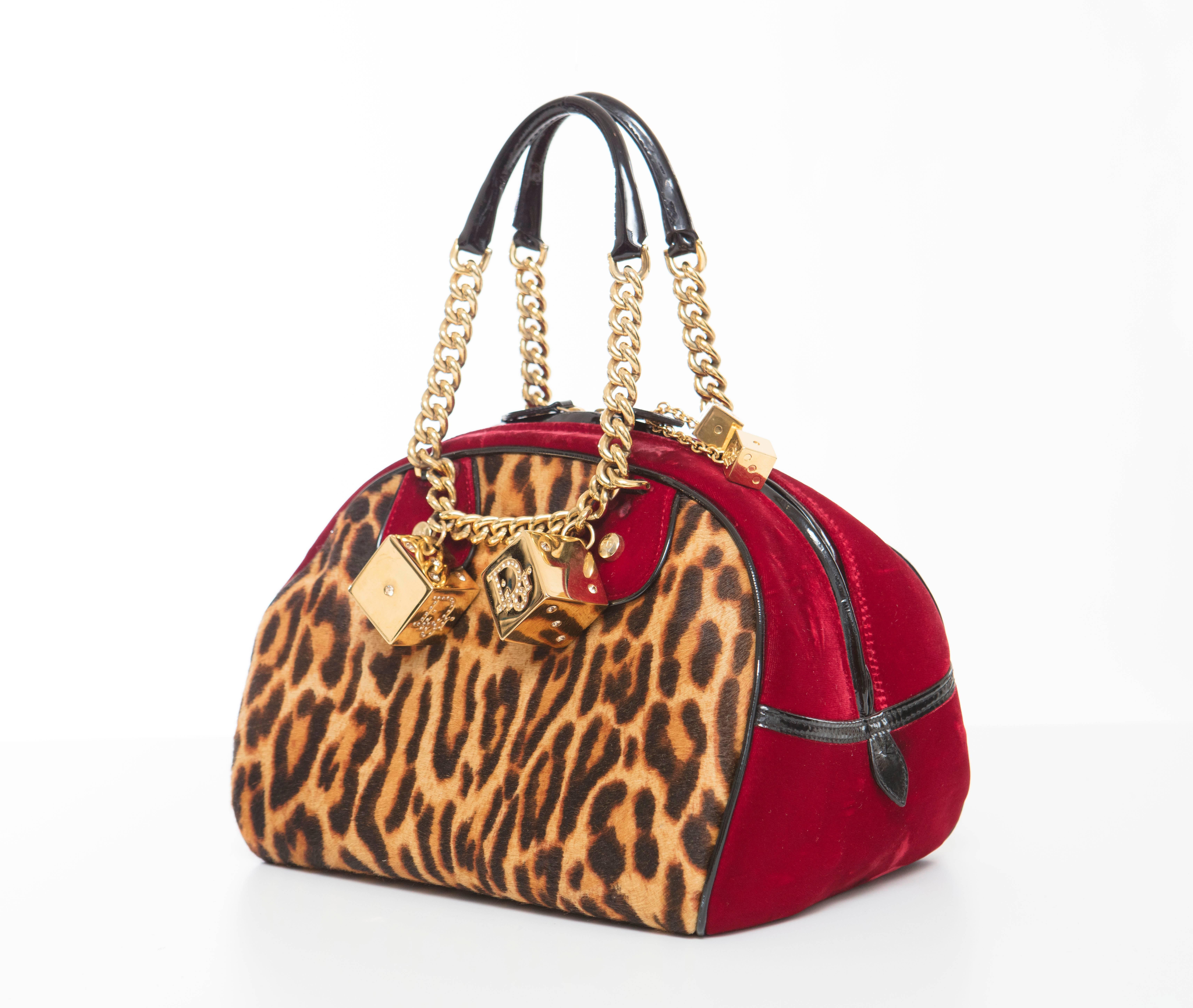 John Galliano for Christian Dior, Fall 2004 leopard Gambler bag with gold-tone hardware,  velvet and black patent leather trim, dual rolled top handles featuring chain-link accents, crystal embellished dice adornments at front face, black Diorissimo