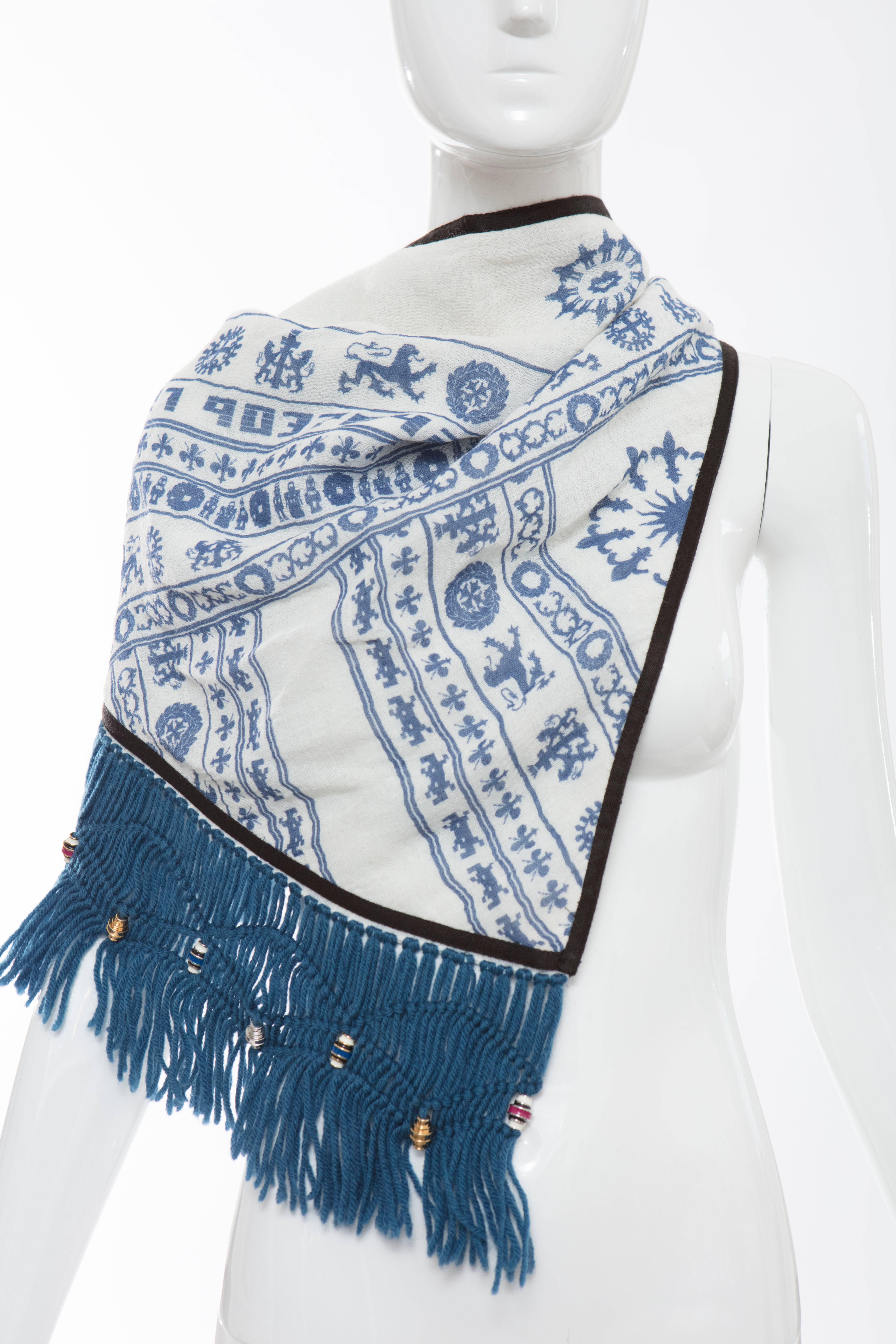 Nicolas Ghesquière for Balenciaga, Autumn-Winter 2007 Keffiyeh cream blue linen cotton woven triangle scarf with abstract pattern throughout and fringe trim featuring enamel bead embellishments.

Length: 42, Width 22

Fabric: 67% Rayon, 22% Linen,