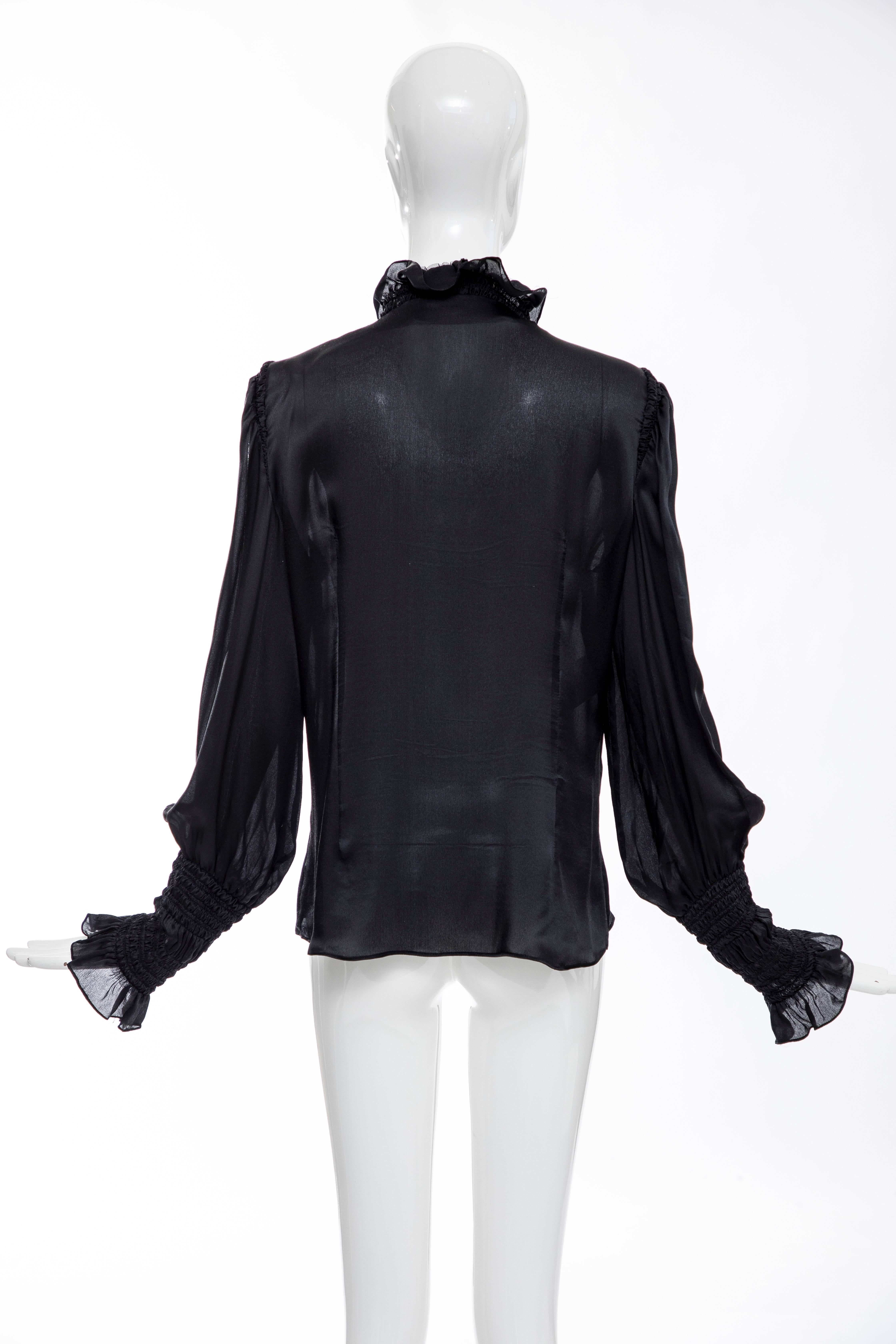 Alexander McQueen, Autumn-Winter 2006 black silk button front blouse with ruffled neckline and shirred cuffs.

EU. 46
US. 10

Bust 42, Waist 36, Length 27