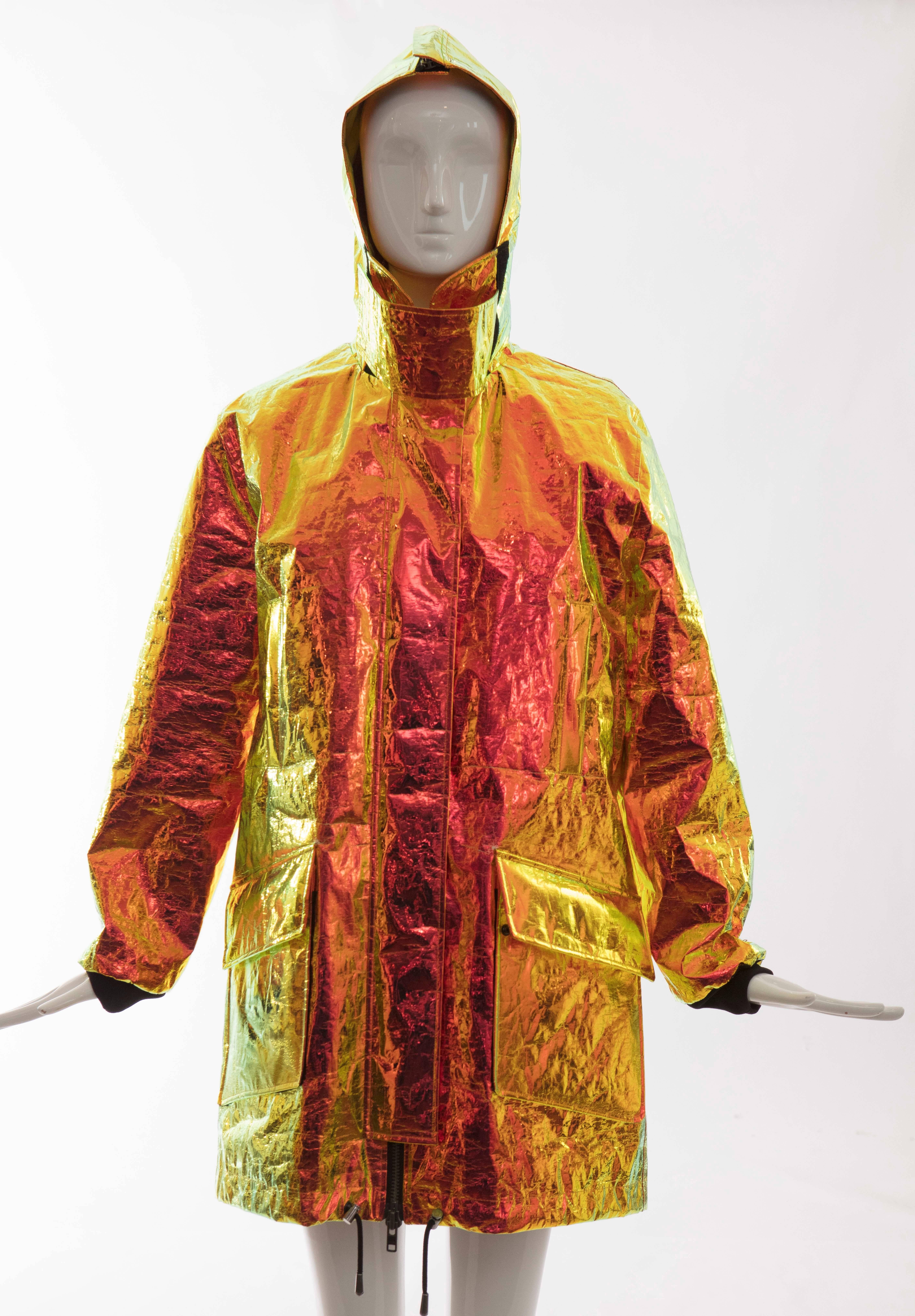 Wanda Nylon, Autumn-Winter 2014, iridescent metallic foil hooded parka, four front pockets, zip and snap front closure, hooded zip and fully lined.
 
 Seen on M.I.A. and Snoop Dog.

Bust 34, Waist 36, Hips 48, Length 36. Sleeve 25, Shoulder 20