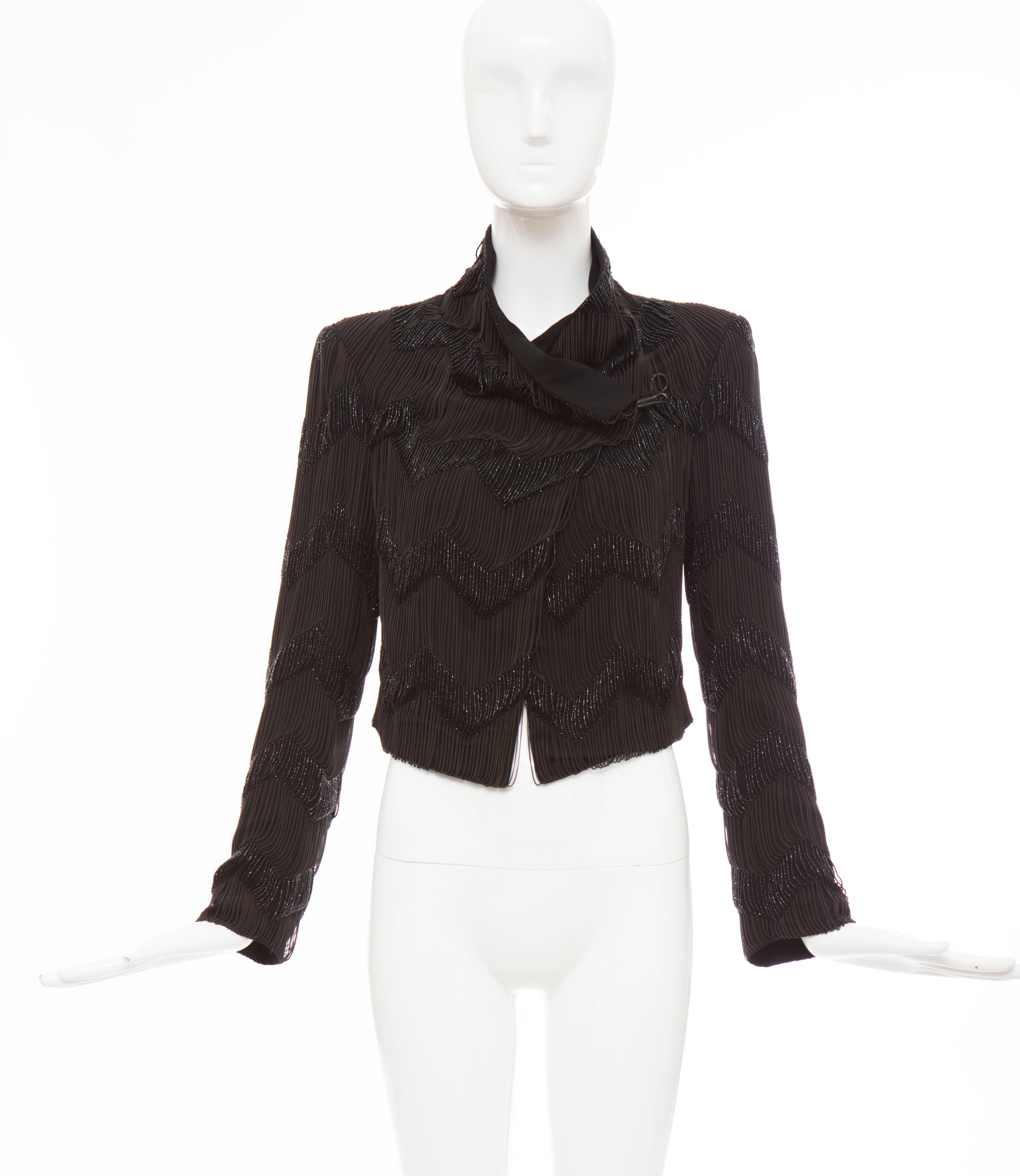 Ann Demeulemeester, Fall 2011 runway black wool chain-link and beaded jacket with hook closure at front and fully lined.

Retail: $5165

IT. 36
US. 4

Bust: 34, Waist 31, Shoulder 15, Sleeve 23, Length 21
