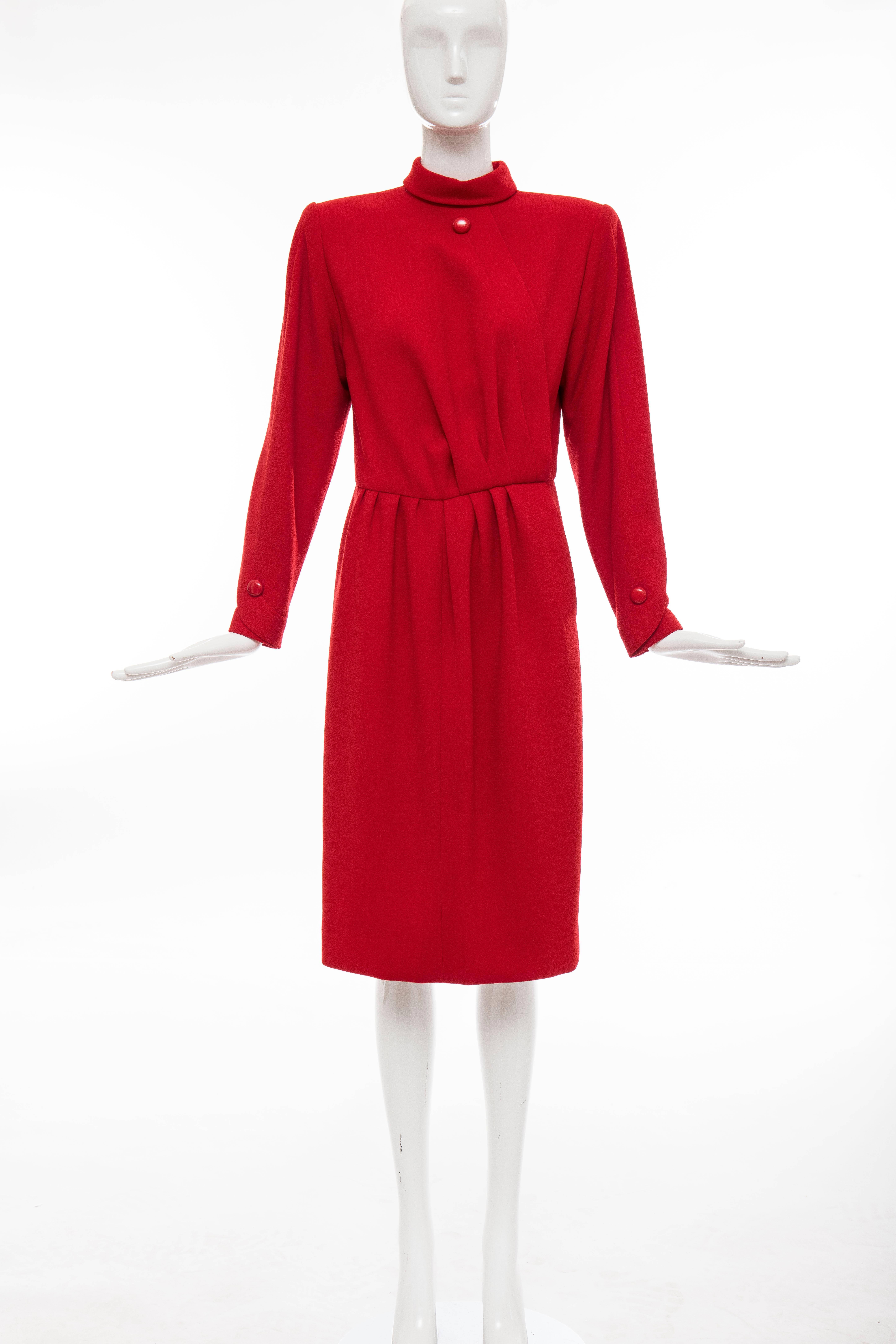Nina Ricci Haute Couture, Circa 1980's red wool crepe dress with pleated bodice and skirt, one front pocket, back zip and hook-and-eye closure and fully lined in silk.

No Size Label

Bust 34, Waist 28, Hips 38, Sleeve 23, Length 43
