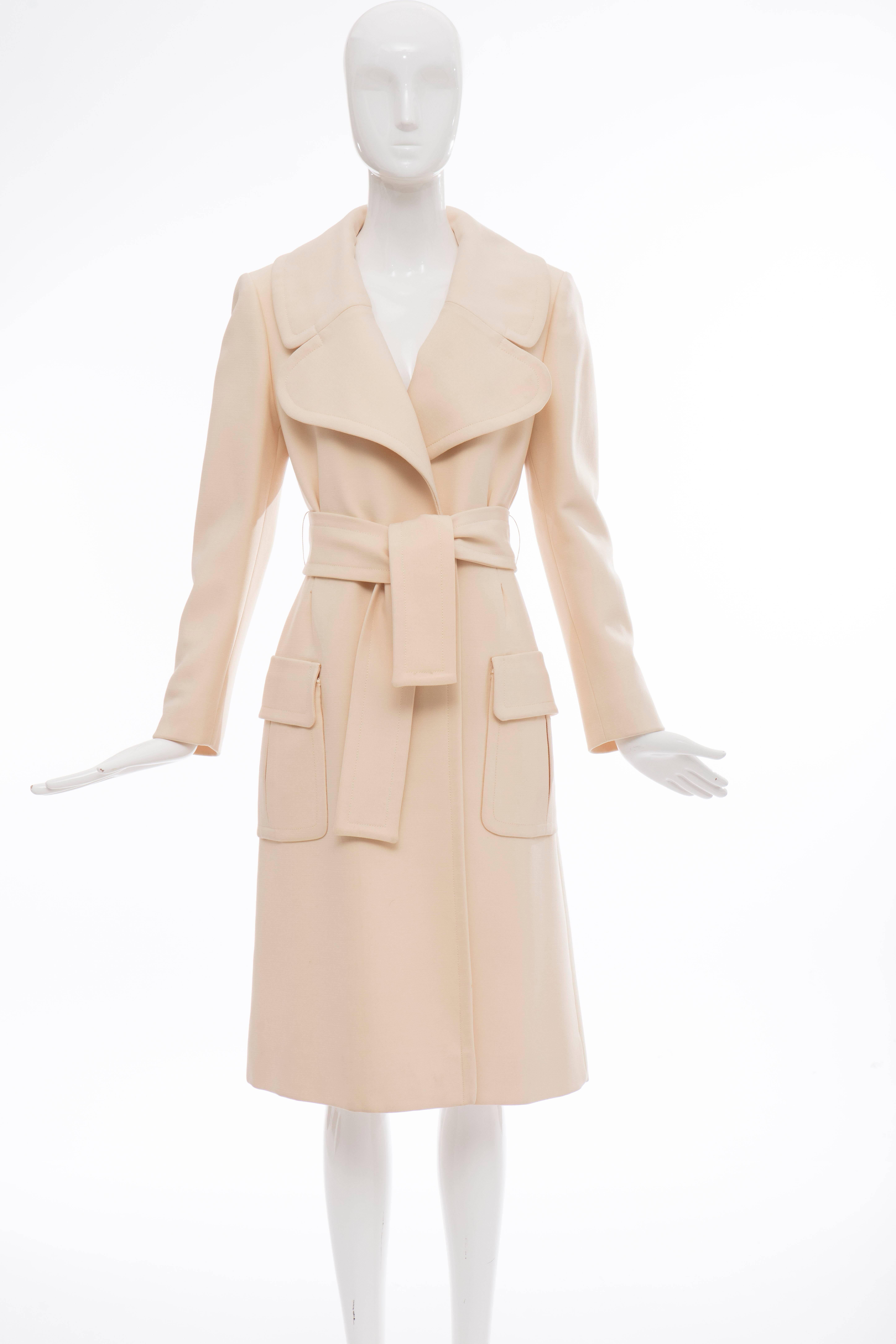 John Anthony, Circa 1980's cream wool gabardine snap front coat with self belt, two front pockets and fully lined.

No Size Label

Bust 38, Waist 34, Hips 38, Sleeve 23, Length 43