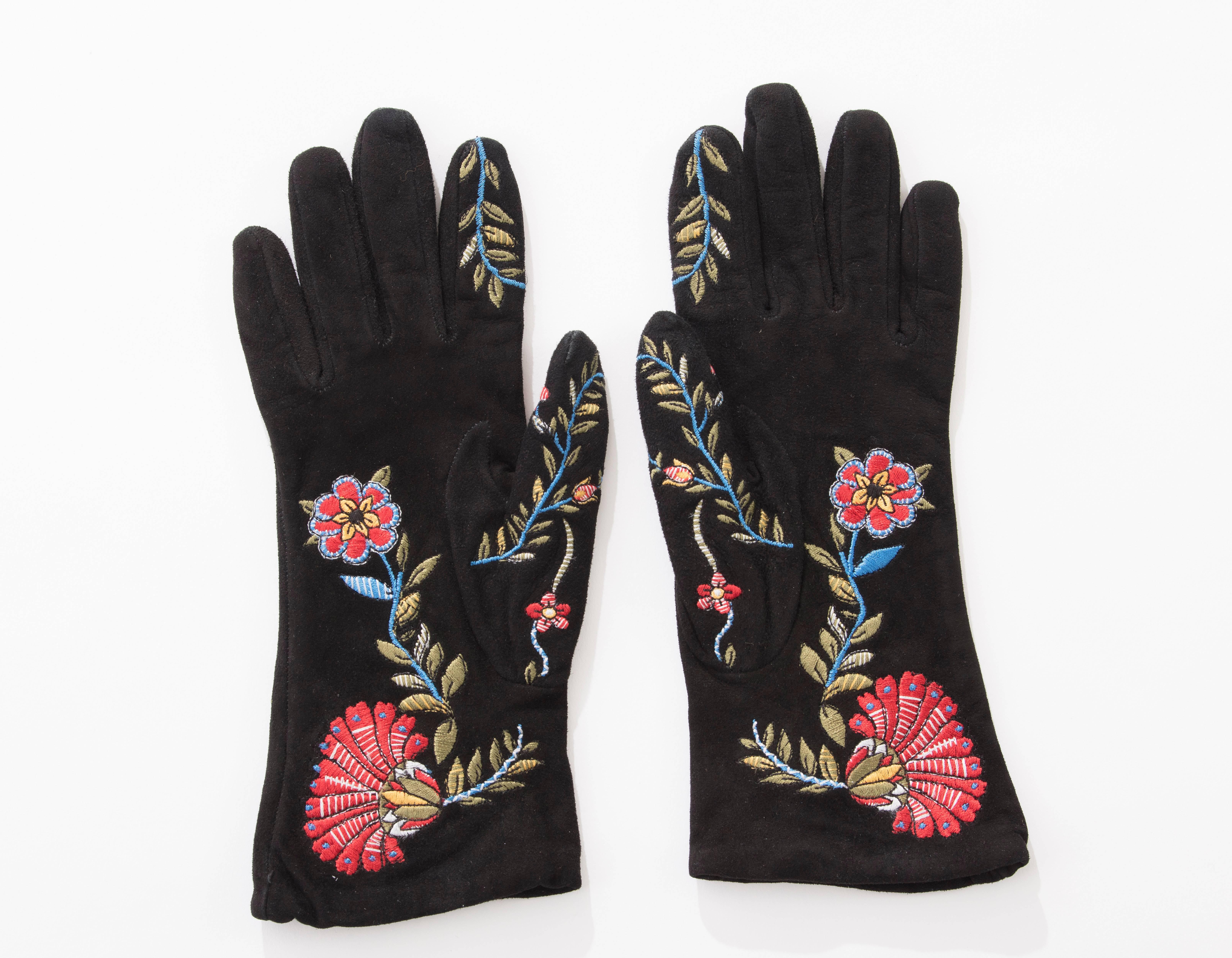 John Galliano for Christian Dior black suede gloves with polychrome floral embroidery, tonal stitching and fully lined in silk.

Length: 9.25, Width 3.25
